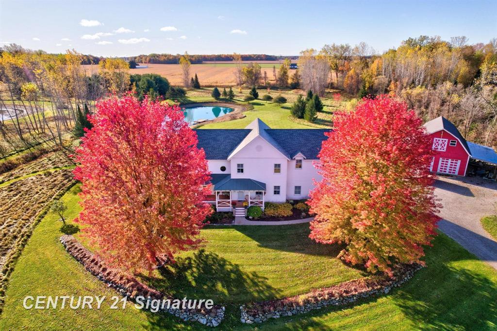 Discover the perfect blend of historic charm and modern luxury in this custom-designed "Modern Farmhouse", situated on 10.18 acres of pristine land just minutes from downtown Midland, and located within the Freeland School District. Thoughtfully crafted by a local architect in 2002, this estate reflects the elegance of an 1800s farmhouse design with a contemporary interior ideal for today's lifestyle.  Step inside to a beautifully appointed "Open Concept" first floor, where a 3-sided fireplace with granite hearth anchors the living room, kitchen, and front entrance with warmth and charm. The "Great Room" with vaulted ceilings and circular windows is only the beginning of your journey through this stunning "One of a Kind" property. Please call for additional details, or better yet, come check out this "One of a Kind" property for yourself! This home comes with a 14-month Home Warranty.