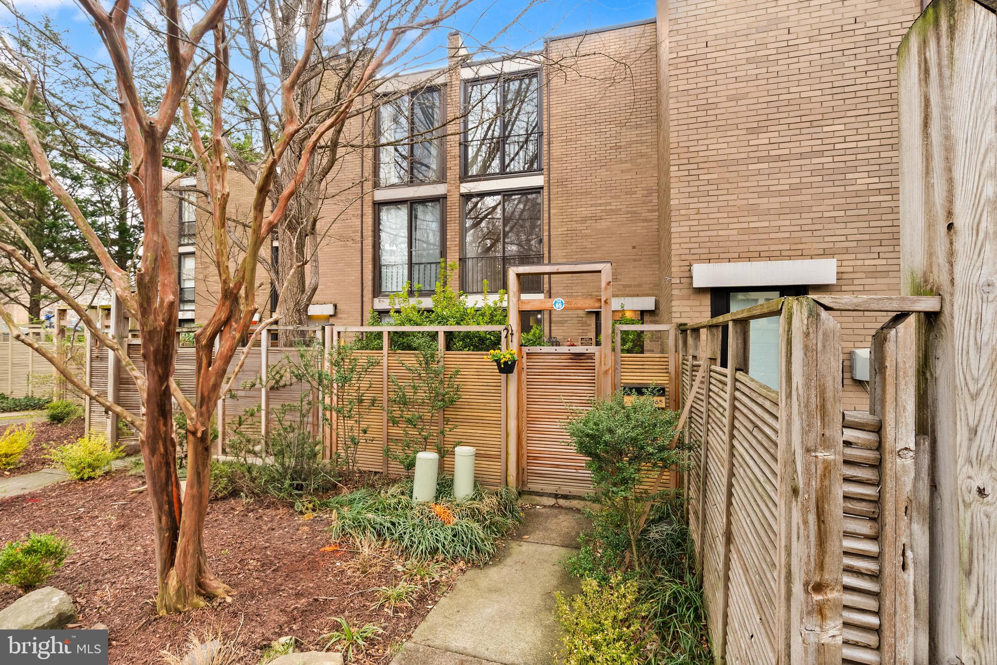 Step into this rarely-available blend of mid-century modern design and serene waterfront living in this stunning Lake Anne townhome, listing on the National Register of Historic Places. With 2,112 square feet of thoughtfully designed space, this home boasts unique architectural features that reflect timeless craftsmanship and style. Step inside to find an inviting combination kitchen and dining area, ideal for entertaining or enjoying quiet meals. This three-bedroom, 2.5-bath home features a unique layout with six different floors, separated by six steps each. The main floor features the kitchen and dining room, while the tiled lower level contains a half bath and access to the backyard and the lake. The first upper level is the living room overlooking the lake, while the second upper level features a bedroom with an en-suite bath. Upper level three has a laundry room and a second bedroom, overlooking the lake. The top floor has the third bedroom and a full bath, allowing for comfort and privacy for everyone in the home. Natural light floods the space through sliding windows, enhancing the warm ambiance throughout. The entire home has been freshly painted, and every bathroom features new vanities and toilets, and the full baths have new flooring. The kitchen features stainless steel appliances and a brand new cooktop. You can be sure that this home stays comfortable and energy-efficient with the new HVAC system, which separates it from the RELAC system used in other homes in the neighborhood. The sliding-glass doors that face the lake are also protected with UV-reducing privacy film.The property offers breathtaking views of the canal and Lake Anne, creating a tranquil backdrop for your daily life. Enjoy the luxury of private dock access, perfect for canoeing or kayaking. You even have your own motorized pontoon boat that conveys with the home and is ready for summer fun on the lake. Being part of the Reston Association allows you to take advantage of the community's exceptional amenities, including multiple swimming pools, tennis courts, playgrounds, walking paths, and more. Embrace the lifestyle you've always dreamed of in this exquisite townhouse. Don't miss your chance to own a piece of this idyllic waterfront paradise!