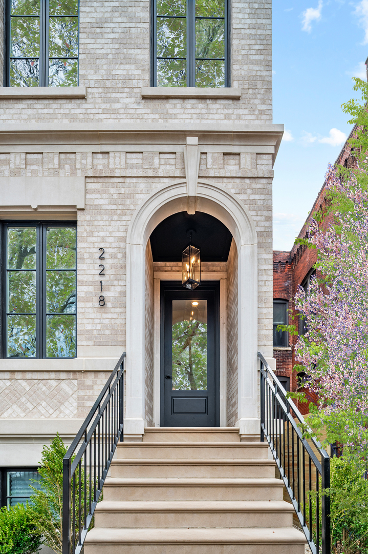 Stunning Lincoln Park Penthouse - A True Urban Oasis! Finished and ready for occupancy. Discover the epitome of luxury living in this magnificent penthouse located on one of Lincoln Park's most sought-after tree-lined streets, just steps from Oz Park. Set on a rarely available 32' wide lot, this property boasts a beautifully detailed facade of classic limestone and brick.   Designed and built by a renowned builder, every inch of this incredible penthouse has been meticulously planned and executed. The main level features two expansive living and entertaining areas, perfect for hosting lavish gatherings or comfortable everyday living. A private office offers a quiet retreat, while a custom bar anchors the stylish kitchen and living/dining/playroom.    The gourmet kitchen is a chef's dream, featuring trendy custom millwork and luxurious natural stone quartzite countertops. Elegant limestone and quartzite fireplace mantels add warmth and sophistication to the living spaces. With an enormous primary suite complete with a walk-in closet and a luxurious spa-like bathroom, this home redefines comfort and elegance. Each bedroom includes its own en-suite bathroom, ensuring privacy and convenience for every resident.The timeless paneling and remarkable attention to detail exude quality at every turn. Enjoy stunning downtown views from several windows, adding a vibrant city backdrop to your everyday life.    Step outside to the expansive rooftop, which spans the entire floor and is outfitted with a wet bar-ideal for entertaining while taking in sweeping views of the Chicago skyline, especially during the unforgettable summer days.This penthouse truly has no rival, combining luxurious living with an unbeatable location in the heart of Lincoln Park. Don't miss your chance to call this extraordinary property home!