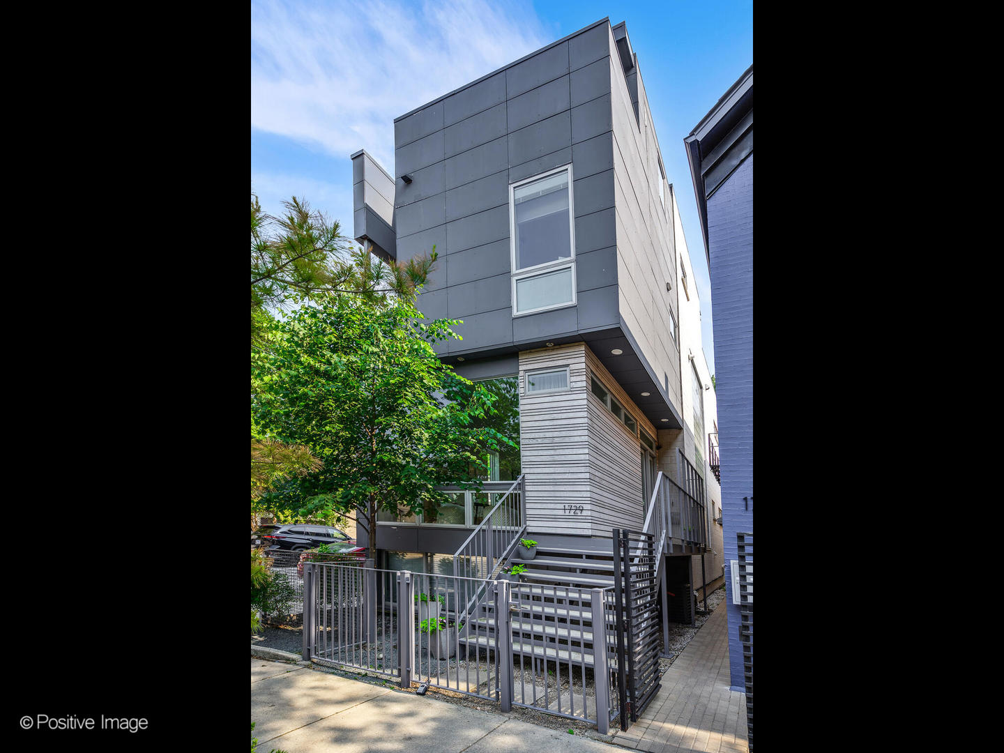 Architect-designed modern masterpiece in the heart of Wicker Park. This sun-drenched 5 bed, 4.1 bath home offers nearly 4,000 sq ft of custom luxury, wrapped in ten distinct outdoor spaces for unmatched indoor-outdoor living.    Every detail is elevated: soaring 10'9" ceilings, walls of glass, radiant-heated concrete floors, and warm hardwoods throughout. The chef's kitchen is both sleek and functional, with Italian cabinetry, an oversized island with recycled aluminum countertops, and integrated Miele appliances-including a built-in coffee station and paneled fridge. Just off the kitchen, slide open the doors to a private rooftop deck above the attached two-car garage.    The primary suite feels like a boutique hotel: a spa-style bath with dual vanities and a walk-in shower, and a jaw-dropping custom closet with built-in island. Upstairs, a sunlit flex room opens to three rooftop terraces with sweeping city views-perfect for lounging, working, or entertaining.    The lower level is built for modern living, featuring radiant heated floors, a spacious media room, custom office space, a sauna, guest suite, and abundant light. Additional highlights include a mudroom entry, second-floor laundry, dual-zone HVAC, and updated decking throughout.    Located on a quiet, tree-lined street just steps from Division, Milwaukee, and the Blue Line, this one-of-a-kind home delivers the perfect blend of architectural vision, privacy, and city lifestyle.