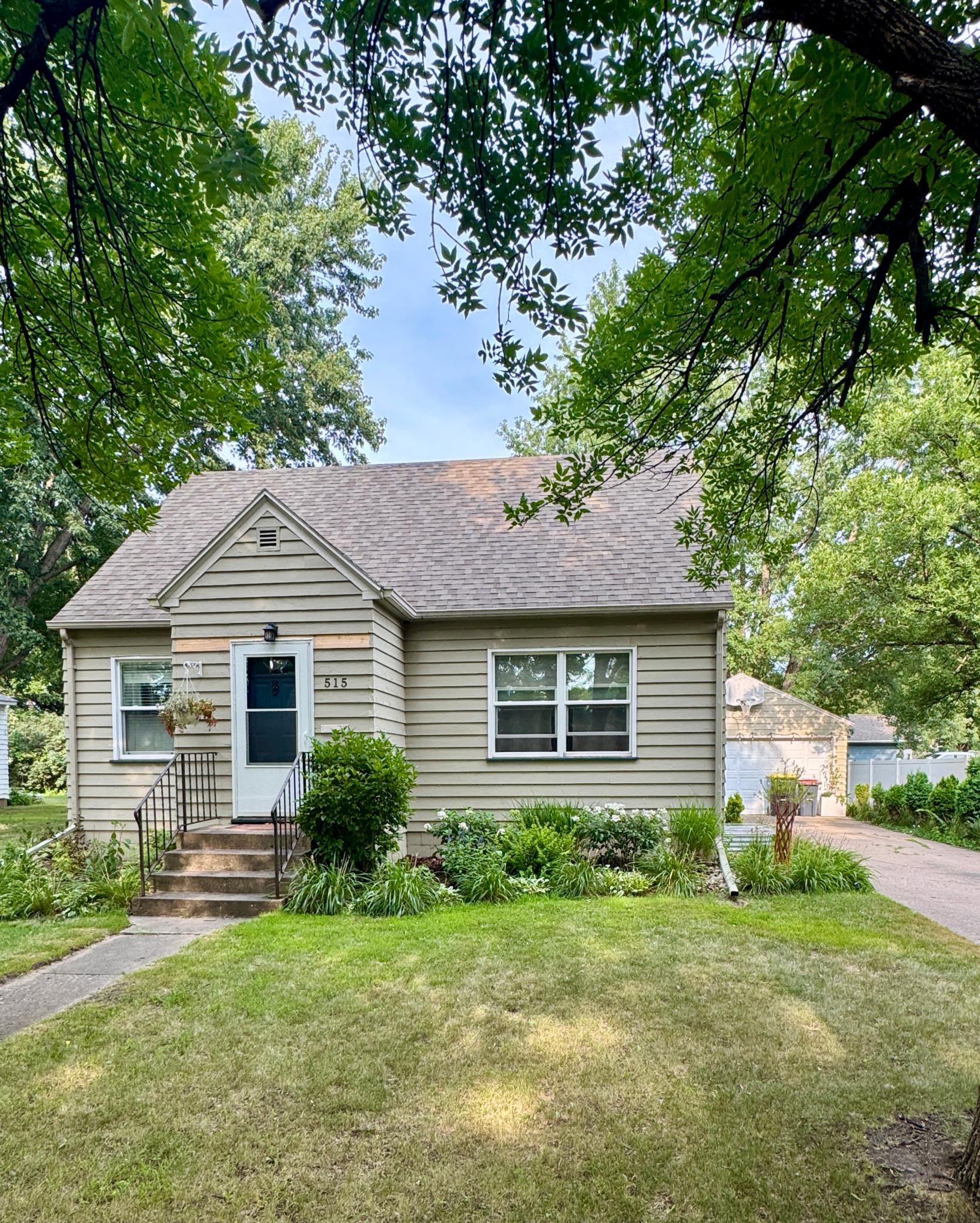 Step into this charming and well-maintained home that perfectly blends timeless character with thoughtful updates. Featuring 2 bedrooms and a beautifully tiled ¾ bathroom, this home offers 1,275 square feet of inviting living space. Rich hardwood floors flow throughout much of the home, while classic arched doorways add warmth and architectural charm. The kitchen comes complete with stainless steel appliances, which includes a gas range making it ready for everyday living and entertaining. The lower level expands your living space with a spacious family room featuring an egress window, offering flexibility for recreation or the potential for an additional bedroom. You’ll also find excellent storage throughout the basement, along with plumbing space already prepared for the future addition of a second bathroom. Upstairs, a versatile office or reading nook just outside the bedroom provides the perfect space for working from home or relaxing with a good book. Outside, enjoy a  beautifully landscaped, private backyard ideal for entertaining, gardening, or simply unwinding. A two-stall detached garage offers plenty of room for vehicles, hobbies, and extra storage. Combining character, functionality, and room to grow, this home is one you won’t want to miss!
