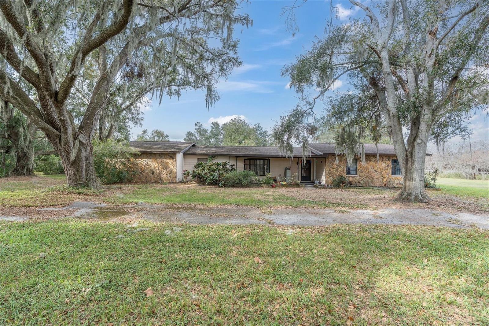Fantastic opportunity on 1.9 acres!This 2,266 sq ft home features 3 bedrooms, 2 bathrooms, a bonus room, a 2-car garage, and a circular driveway, offering space and flexibility for a variety of needs.Ideal for families or investors, the property is ready for updates and minor repairs. Bring your boats, RVs, and livestock — no HOA and not located in a flood zone.Enjoy a peaceful country setting with easy access to I-4 for convenient commuting.Acreage properties like this do not last. Home is sold As-Is. Price reflects current condition. Cash preferred for a quick closing.Schedule your showing today — motivated sellers are ready to move!AC Replaced 2015, Roof 2018