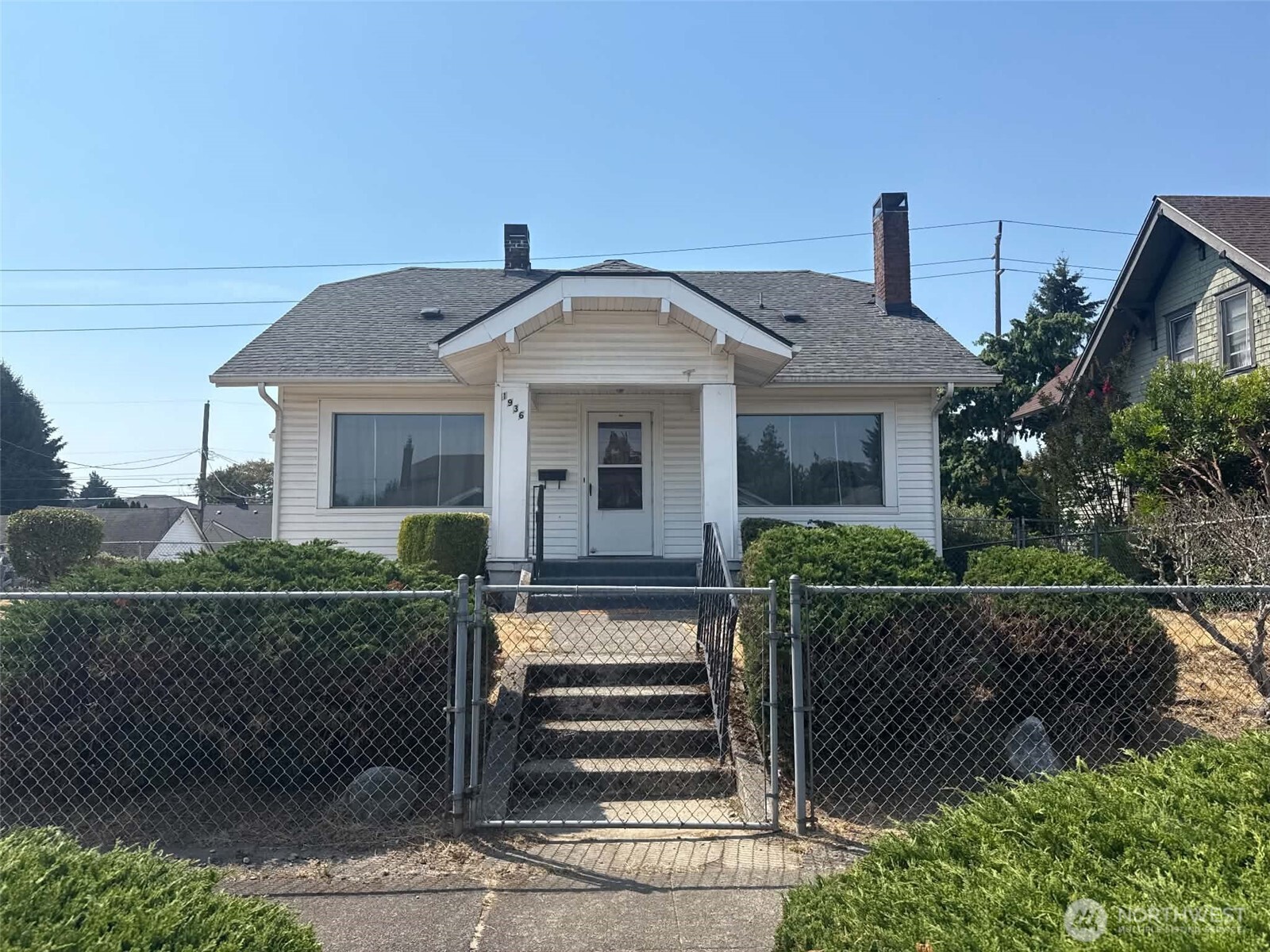 LOCATION, CHARACTER & OPPORTUNITY! This 1925 Tacoma oldie-but-goodie offers something for the homeowner, investor and developer alike! Centrally located with convenient access to I-5, hospitals, schools, light rail/transit, downtown, waterfront, entertainment and cultural amenities. The home offers 3 bedrooms—one on the main level and two upstairs—plus a full basement with additional kitchen, ¾ bath, bonus/flex space and separate entrance. Enjoy a spacious kitchen, fireplace, covered deck, fully fenced grounds, sprinkler system, garden possibilities, ample parking and detached garage. INVESTORS & DEVELOPERS—take note! Approximately 9,750 SF of land encompassing 3 platted lots creates an exciting opportunity to explore additional housing and redevelopment possibilities under Tacoma's Home in Tacoma middle-housing framework. Live in, renovate, hold, or explore future development potential. Sold AS-IS. Buyer to verify zoning, permits, lot status, development capacity and allowable uses to their satisfaction.