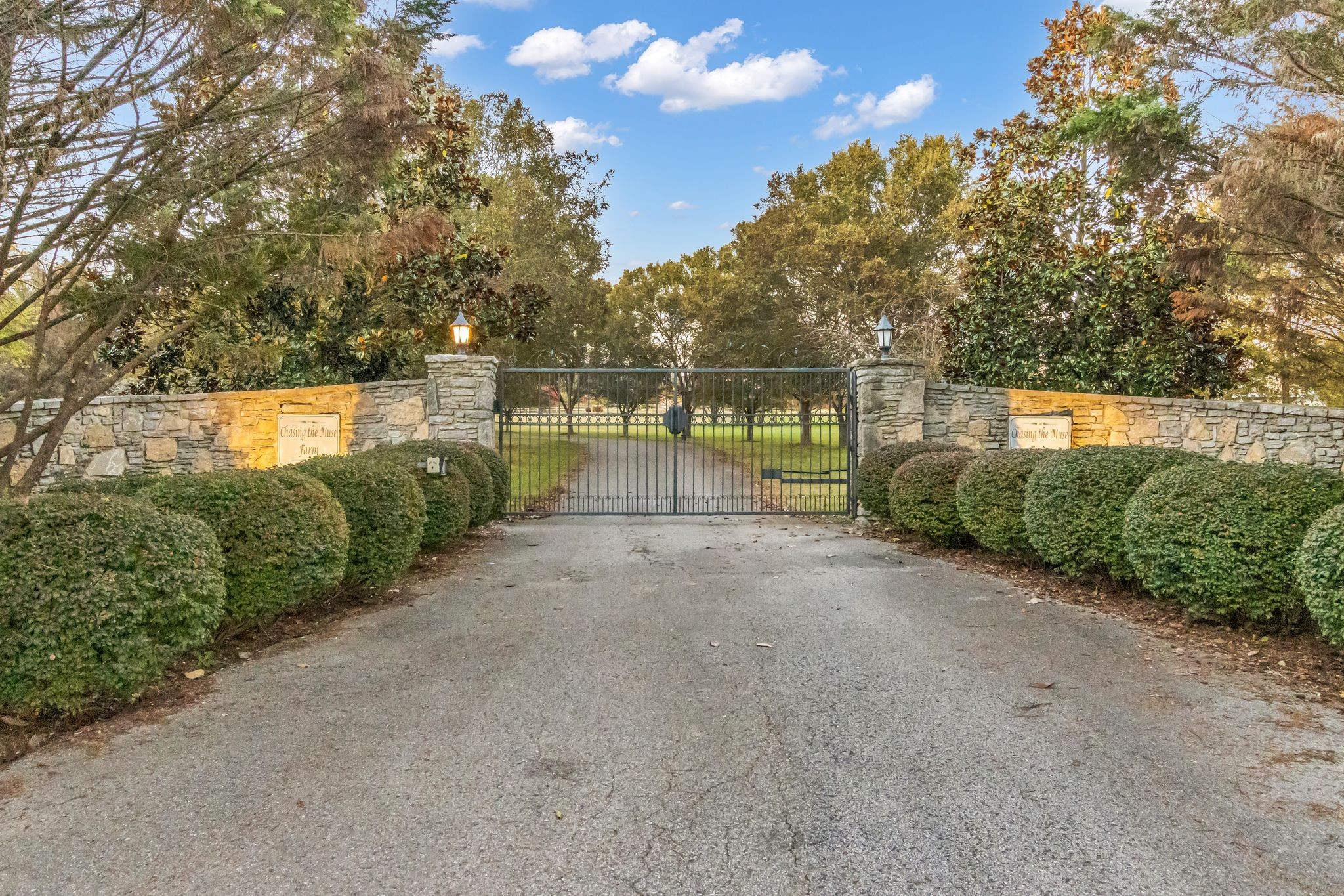 Private Gated State of the Art Equestrian Facility Nestled in A Quiet Community. Beautiful Established Tree Lined Entry Drive with Level Fenced Pastures. Indoor and Outdoor Arena. Two Barns with 41 Oversized Stalls, Indoor Arena with Watering System, 6 Stall State Certified CEM Quarantine Barn. Beautiful Contemporary Home Two Story Home Above Large Storage Area. Contemporary Home with Great Room with Wall of Windows and Fireplace Open to Chef's Kitchen and Dining Area. Primary Bedroom with Spa Bath with Soaking Tub, Walk-in Marble Shower, Double Vanity and Walk-in Closet. 2 Additional Bedrooms, Full Bath and Laundry Room. Designer Lighting. 2 Cottages Each with Kitchen and Bath. Ample Land to Build an Estate Home. Additional 200+ feet of Land at Back of Property Beyond Fence. Property offer Serenity and Privacy with all the Conveniences Located Just Minutes Away. Note Main Floor Footage is Barn/Garage Area.