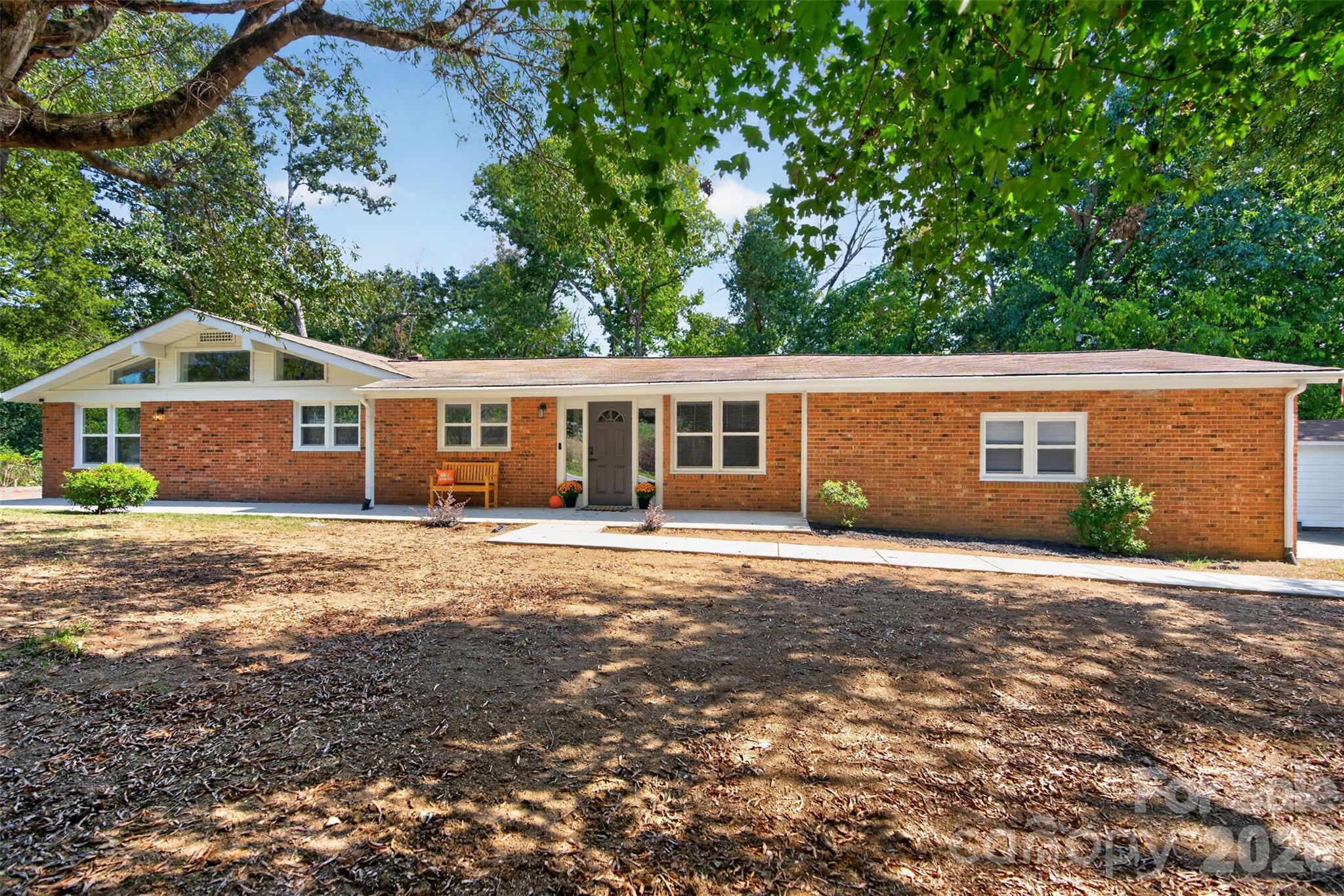 Rare opportunity to own a fully remodeled, turn-key ranch-style home in a highly desirable location! Every detail of this refurbished property has been carefully upgraded for modern living, offering peace of mind with brand-new plumbing, updated electrical, and energy-efficient new windows throughout.Step inside to an open and airy floor plan featuring durable, contemporary luxury vinyl plank (LVP) flooring that flows seamlessly across the main living spaces. The stunning, brand-new kitchen is equipped with brand-new appliances, sleek backsplash finishes, updated cabinetry, and ample counter space. Both bathrooms have been completely transformed with contemporary, stylish fixtures and modern tile work. The property also boasts a fully remodeled garage, meticulously designed to provide secure parking while preserving plenty of dedicated room for extra storage or a workshop. The newly remodeled basement features warm LVP flooring, bright recessed lighting, large standard windows, and a walkout to a patio, transforming the lower level into a cozy and safe guest bedroom.Location is everything! Situated just minutes from the world-class Charlotte Motor Speedway, you will have easy access to premier racing events and entertainment. Enjoy unparalleled convenience with massive retail shopping destinations nearby, alongside the charm, local dining, and boutiques of historic downtown Concord. This move-in-ready gem offers the perfect blend of modern charm and unbeatable proximity. Schedule your tour today!