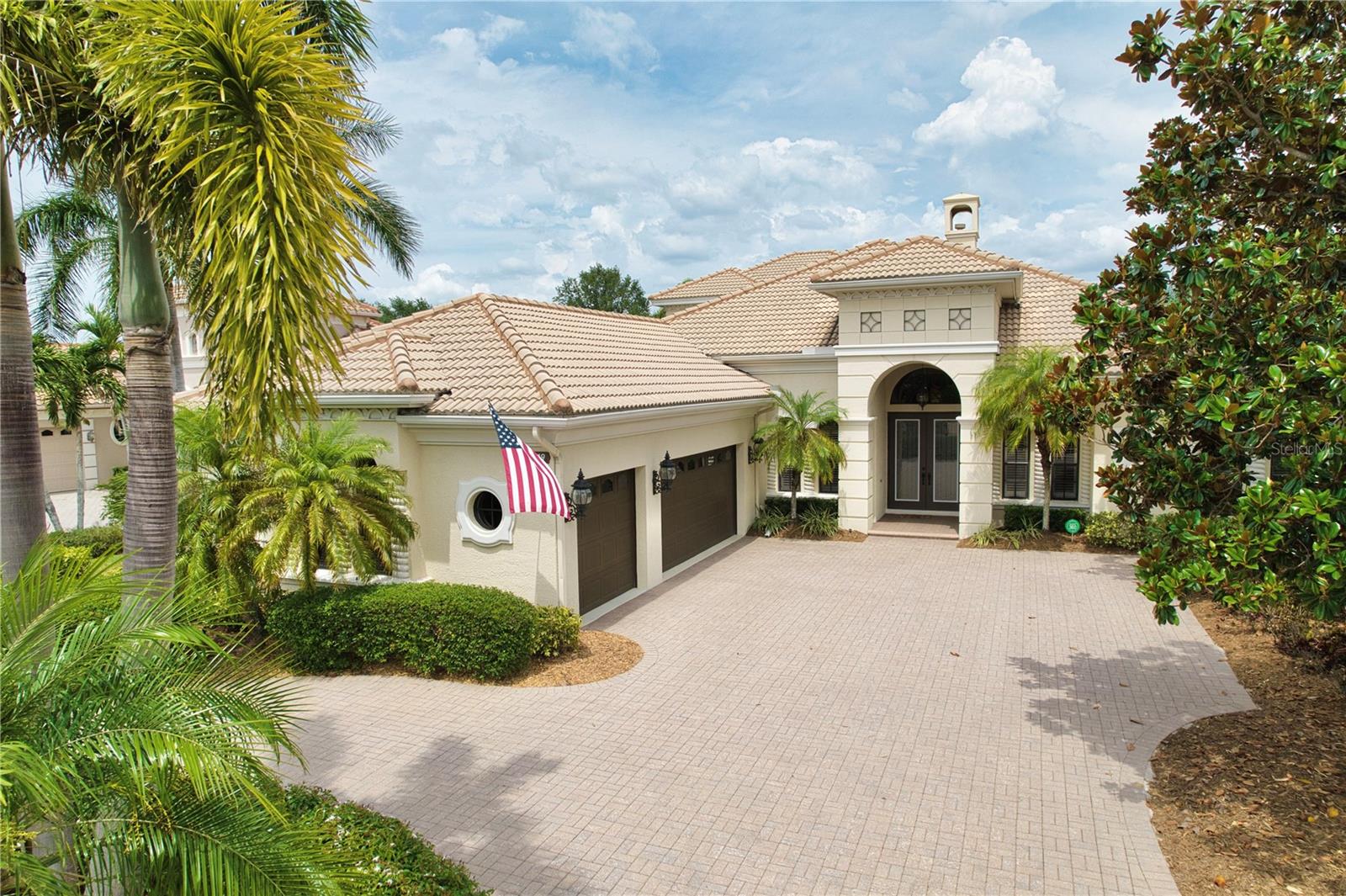Arthur Rutenberg masterpiece – The St. Vincent II model – offers the best in Florida luxury living. Welcome to "The Dominion" one of the most sought after streets behind the gates of The Lakewood Ranch Country Club.  Located on a premier homesite this "like new" home offers: 6 bedrooms, 4 full baths, a spacious office, and an upper level bonus room. Architectural details abound: the stately exterior beckons you inside to take in the intricate crown molding, high tray ceilings and built-in features. The executive office located in the front of the home is spacious with built-in work space, cabinetry and is full of natural light. Bedroom 2 is located at the rear of the home overlooking the golf course, and sliding glass doors open onto the pool deck, which could also be another private office if desired.  The chef’s kitchen features solid wood cabinets, a built-in pantry, and has been recently updated with Quartz counters and high-end SS appliances.  Storm rated windows and sliding doors draws both light and views inward and flow through the main living areas. High decorative ceilings throughout create a sense of timeless sophistication. The primary suite is conveniently located on the main floor in its own private wing. With high ceilings, access to the pool and lanai area, this suite will accommodate large estate furnishing in style. Dual walk-in closets, and a luxurious and recently updated bath with a large walk-in shower, garden tub, and private water closet with bidet, round out the primary suite.  The upstairs contains a large bonus room, the 6th bedroom and 4th bath, and a dreamy covered balcony. Outdoor living is elevated while enjoying your screened in private saltwater pool and spa oasis.  Surrounded by tropical foliage unwind under the covered lanai or at the cabana with a fully equipped modern summer kitchen—perfectly designed for year-round entertaining. The circular paving brick driveway, side-entry garage, and dual 220V EV charging stations add modern convenience as well as curb appeal. RECENT UPDATES: travertine-style porcelain tile, luxury vinyl plank flooring, new countertops throughout (except office), newer appliances including dishwasher, refrigerator, oven, cooktop, and dual-function microwave, front loading washer & dryer, All 3 AC units replaced with high-efficiency filter systems, and a 24KW natural gas Generac Whole House Generator keeps everything running during power outages, updated security system, recently refinished wood ceilings and freshly painted cabinetry (excluding office), along with an upgraded outdoor grill and hood. 2025 Roof inspection report available. Windows are rated for 130mph wind loads. Resort-style living with an optional membership to The Lakewood Ranch Country Club—offering 4 championship golf courses, 3 luxurious clubhouses, 18 Har-Tru tennis courts, pickleball, state-of-the-art fitness and aquatic centers, walking trails, and many social events. With no waitlist and optional membership, the choice is yours. Situated near high-rated schools, premier medical facilities, parks, shopping, dining, and just minutes to Gulf Coast beaches, this property represents a lifestyle of luxury. Schedule your private showing today.