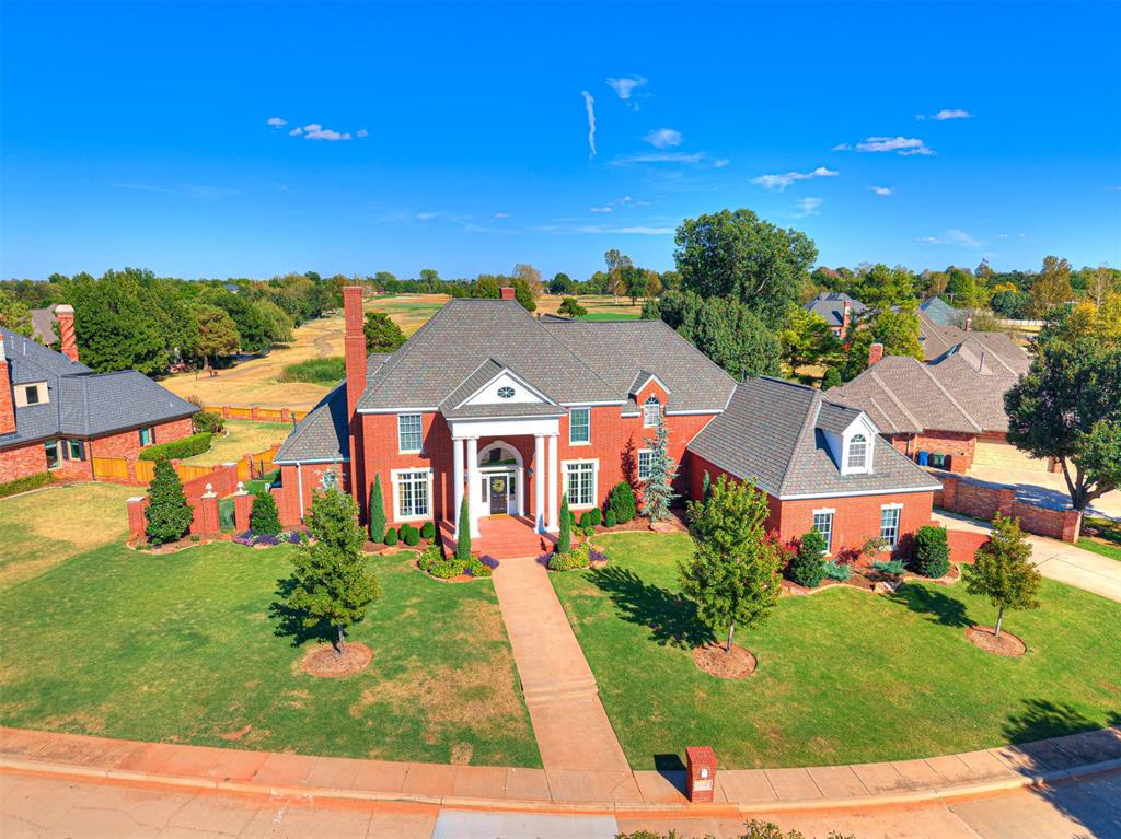 Enjoy a Prime Golf Course Setting in the lively Oak Tree Community.  Welcome to 1709 Irvine Drive!  This Grand Estate has it all!  5 bedrooms, 4 and 1/2 baths, 2 Main Living Rooms, Study, Dining, Kitchen, Upstairs Bonus Room and Media Room, Outdoor Kitchen, Sparkling Pool and ONE OF THE BEST GOLF COURSE VIEWS in the neighborhood!  The grand entry opens to a light and bright space with an abundance of windows across the back of the home to allow views of the pool, pond and golf course in almost every room. A cozy dedicated Study complete with fireplace, a spacious Dining Room with Butler's Pantry for your large family dinners, the Main Living, the Family Room, the Primary Bedroom/Bath and a separate Guest Bed and Bath all on the main level for convenience.  The kitchen has been remodeled with designer touches and a floor-to-ceiling fireplace centers the family room.  Even the laundry room is spacious with plenty of storage to make laundry a breeze.  Upstairs, the remaining three bedrooms, 2 baths, bonus and media rooms complete the space.  But, the outdoor space is the crowning jewel!!  A sparkling pool, outdoor kitchen, plenty of patio space, a firepit and again...one of the BEST GOLF COURSE VIEWS in the neighborhood.  Oak Tree is one of the premier golf course communities in Oklahoma.  In the highly rated Edmond School District, this secure neighborhood with mature trees celebrates an active lifestyle while having the peacefulness of a golf course community with easy access to all that North Edmond has to offer.  This one is a GEM!  Schedule your private tour today.