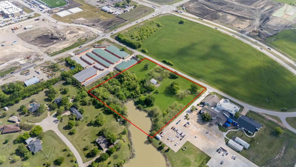 One of the most exceptional commercial opportunities in all of Collin County, this prime 5.657-acre tract is ideally positioned just steps from the highly trafficked hard corner of Custer Road and Frontier Parkway. Perfectly situated at the convergence of Prosper, Celina, and McKinney, the location offers unmatched visibility, accessibility, and long-term growth potential.The property lies directly across from the highly anticipated Custer Frontier Marketplace, a transformative 127-acre master-planned development anchored by a 118,000-square-foot Kroger Marketplace and complemented by an exciting mix of retail, dining, and medical users. The development will also feature approximately 300 new residential homes along with 11 acres dedicated to multifamily and mixed-use projects—making this one of the most significant developments in the area’s recent history.Zoned for a wide range of commercial uses, permitted applications include professional office condos, licensed child care center, house of worship, private or parochial school, pet day care, nursery, and farm and ranch feed store. No medical use permitted. This flexibility provides a strong foundation for a variety of investment or development strategies.Surrounded by some of the area’s most prestigious communities—including Mustang Lakes, Christie Farms, and Amberwood—this site benefits from a high-income, rapidly expanding population base. Additionally, a brand-new Prosper ISD elementary and middle school are currently under construction just moments from the property, further enhancing long-term demand.The property spans the full frontage between Rhea’s Mill Baptist Church and the adjacent self-storage facility, offering substantial presence and development potential.An outstanding opportunity for investors and developers to secure a premier commercial site in the path of explosive growth—prior to the next wave of value appreciation. Survey available upon execution of an accepted contract.