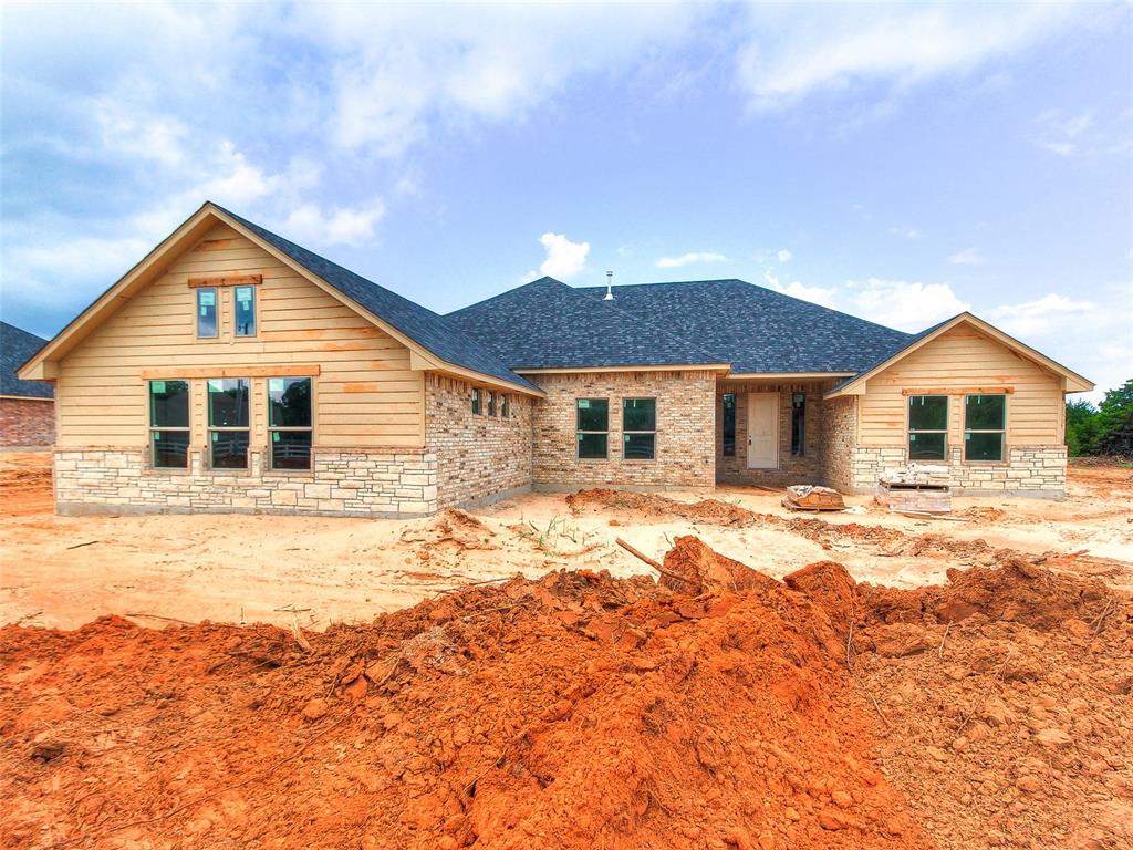 The seller is offering $5,000 in buyer incentives — use it toward closing costs, upgrades, or a rate buy-down to make this dream home even more affordable! Brand new home in the beautiful Whispering Winds addition — now under construction! This thoughtfully designed home will feature 4 bedrooms, 3 bathrooms, a flexible bonus room, and approximately 2,400 square feet of living space, all situated on a spacious &#177;0.75-acre lot. You'll love the oversized 4-car attached garage, the large utility room with plenty of storage space, and the inviting family room anchored by a cozy wood-burning fireplace. The kitchen will boast granite countertops, stainless steel appliances, and stylish finishes throughout — perfect for daily living and entertaining. Whispering Winds offers peaceful surroundings with plenty of room to breathe, yet keeps you close to all the conveniences of town. Don’t miss your chance to own a brand-new home on a generous lot in one of Edmond’s most exciting new communities!