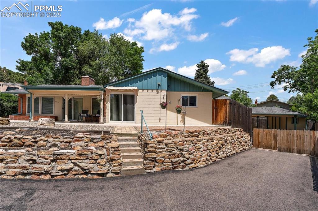 Welcome to this beautifully maintained 1,544 square foot home that combines mid-century charm with smart modern updates. Featuring two oversized bedrooms, two bathrooms, and a versatile layout including several spaces for an office station, this home is ready for you to move in and make your own. Enjoy scenic views of Palmer Park everyday as you watch the sunset from your fantastic front porch. Step inside to find solid surface flooring throughout, neutral interior paint, and large newer windows with custom blinds that flood the space with natural light. The kitchen is equipped with stainless steel appliances, a pantry, and convenient access to the spacious dining and living areas. Enjoy year-round comfort and peace of mind with new Class 4 impact-resistant roofing shingles (that will lower your home insurance premium), copper drain pipes, thoughtful updates throughout, and a washer and dryer included in the large multi-purpose room. Outside, the completely xeriscaped front and back yards are filled with succulents, flowering bushes, native rocks and boulders, and mature plantings—low maintenance and eco-friendly! The fenced backyard includes a clothesline, three storage sheds, and there is plenty of space for an RV to park. Relax, entertain, and create an outdoor living space on the large front covered patio or in your nearly enclosed two-car carport. Additional features include fantastic closet space and storage, original 1959 blueprints of the home, and other delightful surprises you’ll discover during your showing. Don’t miss this unique gem—schedule your tour today!