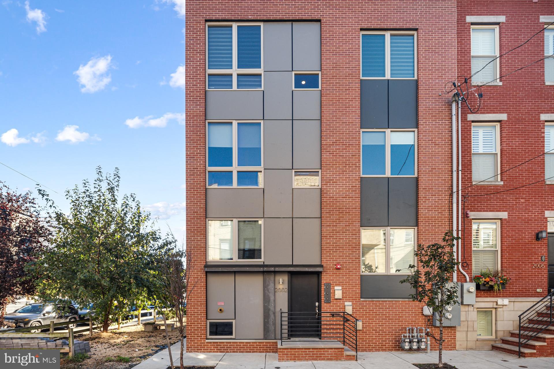 Gorgeous new construction condo built in 2021 by Innova Redevelopment with 5 years still left on the tax abatement! 2002 Annin Street is located on a great block in Point Breeze where new construction and renovations abound. Located just south of Washington Ave, this home is walking distance to the Dock Street Brewery, On Point Bistro, Sardine Bar, the restaurants in East Passyunk Square, Rittenhouse Square and more. Many other appealing Philly neighborhoods, easy transportation, and rich green spaces are close by. The apartment comes with a LARGE storage room in the basement measuring roughly 10' x 10' (not shown in photos, head to the basement to see). Expanding on Innova’s successful ULI Award-winning model, this new construction condominium incorporates energy efficient building materials including Zip sheathing, spray foam cavity insulation, insulated basement floors, Energy Star appliances, doors, windows and lighting, high-efficiency power vent water heater, and a high-efficiency, right-sized heat pump HVAC system with ERV (energy recovery ventilator) for balanced ventilation and fresh air. The high-efficiency HVAC is paired with a Nest learning thermostat to maximize efficiency and comfort. These features ensure affordable operating and maintenance costs and contribute to the Energy Star for Homes certification the home has earned. The facade is a unique combination of brick with Hardie fiber cement panels in a design that provides passive shading on hot summer days, one of the many Passive House design features incorporated into the condo. To the east of 2002 Annin St is a quaint green space (not part of this property) that is highlighted by the beautiful mural encompassing the entire side of the property. Enter this double wide one floor unit and you will be impressed with the carbonized stranded bamboo flooring throughout all the living areas into the custom kitchen. The kitchen offers a great space with beautiful shaker cabinets and granite countertops complimented by a clean yet classic subway tile back-splash, complete with state-of-the-art stainless steel appliances. To the left of the entry you will find two of the three bedrooms, two well-appointed full bathrooms and the laundry section. To the right, the 3rd bedroom and the remainder of this condo's living space. Additionally, the basement is a shared storage area for all 3 units. This home is priced to be affordable to families earning below 120% of Area Median Income. A GRANDFATHERED IN FULL tax abatement has been approved as well, and has 5 years remaining!