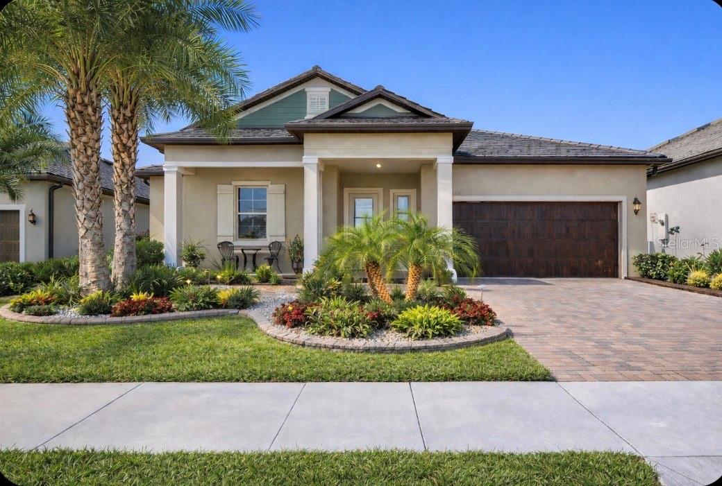 Motivated sellers!!! Welcome to this extensively upgraded residence in Medley at Mirada a premier 55+ gated community offering the perfect blend of luxury, comfort, and vibrant active living. Built in 2022, this thoughtfully designed 2-bedroom, 2.5-bath home with a versatile flex room features over $100,000 in carefully curated upgrades that truly set it apart.From the moment you arrive, the enhanced front elevation, extended patio, professionally coated driveway, and lush landscaping with custom borders and exterior lighting create exceptional curb appeal. A custom rear island and detailed exterior finishes elevate the home’s overall presence.Inside, the open-concept floor plan is filled with natural light and anchored by upgraded ceramic tile flooring throughout the main living areas. The kitchen is both elegant and functional, showcasing granite countertops, a spacious island with pendant lighting, a butler’s pantry, oversized walk-in pantry, and a designer backsplash added in 2024. The seamless flow between the living and dining areas leads to the GORGEOUS 600-square-foot screened lanai expanded with a concrete slab, finished with epoxy flooring, and covered by a new flat roof. This impressive outdoor retreat includes a retractable motorized screen and two remote-controlled awnings with integrated lighting (2023), making it ideal for entertaining day or night.The primary suite is a private retreat featuring dual vanities, a walk-in shower, and a fully customized walk-in closet by California Closets, complete with matching built-in cabinetry and upgraded tile flooring. The guest bedroom offers its own en-suite bath, providing comfort and privacy for visitors. The enclosed flex room, enhanced with newly installed glass double doors (2024), serves perfectly as a home office, third bedroom, creative studio, or additional guest space.Additional upgrades designed for modern living include: • Water softener with reverse osmosis (2022) • Whole-home Alexa system • Remote-operated blinds by Tropical Elegance • Upgraded ceiling fans and dining chandelier (2023) • New sliding glass doors with added double screens (2024) • Ecobee smart thermostat (2025) • Whole-home surge protector • Upgraded refrigerator, dishwasher, and convection microwave • Extended flat roof with added gutters (2023) • 2-car garage with walk-up attic storage (no ladder required) • Professionally coated driveway (2025)Every detail has been intentionally selected to combine sophistication with everyday functionality.Living in Medley at Mirada means enjoying resort-style amenities, including a private clubhouse, heated pool, poolside bar and café, ballroom, yoga studio, fitness center, card and billiards rooms, pickleball, tennis, shuffleboard, bocce courts, dog parks, and a full calendar of social events. Residents also enjoy exclusive access to the breathtaking Mirada Lagoon a 15-acre lagoon offering beach-style shores, swimming, kayaking, paddleboarding, waterslides, a swim-up bar, and year-round entertainment.The HOA includes ULTRAFi high-speed internet, premium cable, lawn care, exterior painting, and the convenience of a golf cart friendly community.This is more than a home it’s a fully elevated lifestyle in one of Florida’s most desirable active adult communities.