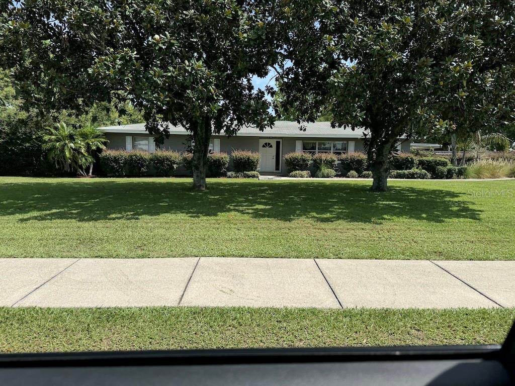 Rare 1.36-acre mixed-use development opportunity on Clubhouse RoadLocated at the high-visibility intersection with US-98 south, this versatile property features a solid 1,736?sq?ft, 3-bed/2-bath masonry home built in 1969, plus a detached shop with large shop that includes full electrical, insulated ceiling, all on a 6 inch concrete slab. The lot is currently zoned RL3X residential, but offers immediate potential to be rezoned OCX (Office Center) or even TCX (Town Center Mixed-Use) to accommodate a range of light commercial uses—ideal for an office, medical, restaurant, retail concept or combination.Positioned across from a Publix-anchored shopping plaza, adjacent to multifamily and professional office uses, and just south of the Polk Parkway/SR?60 corridor, the parcel offers premier access and visibility. Municipal utilities and road retention are already in place nearby. Perfect for developers, investors or business owners seeking a strategic site with both residential utility now and commercial upside ahead. Don’t miss this opportunity to transform a solid home into a lucrative mixed-use asset.