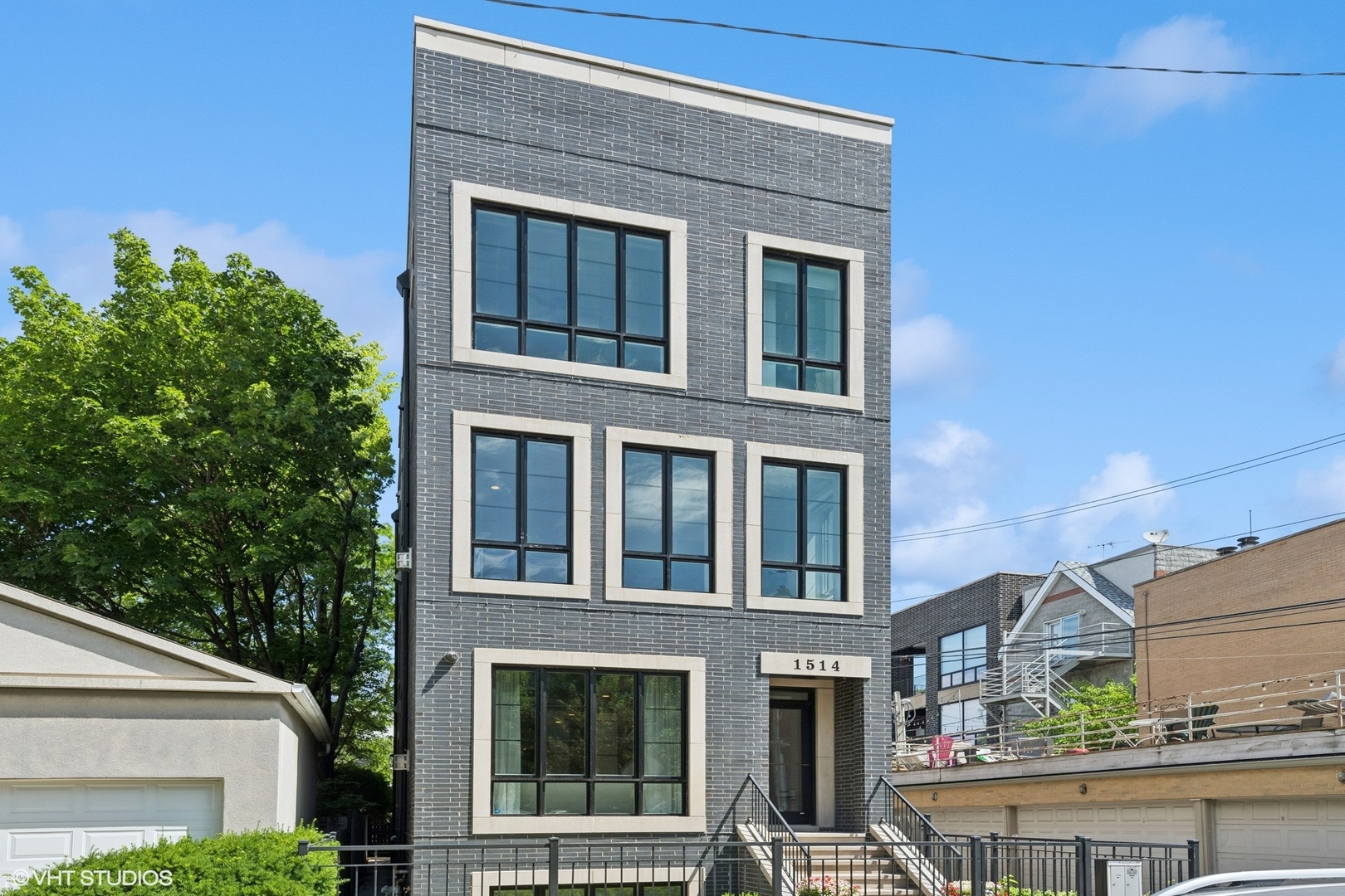 Sun-filled and impeccably maintained, this 3-bedroom, 2.5-bath penthouse duplex offers over 2,400 square feet of luxurious living space, elevated by exceptional outdoor areas and located on a quiet, tree-lined street just steps from Wrightwood Park in the heart of Lincoln Park. Positioned on the top floor of an intimate building, this home benefits from abundant natural light, expansive treetop views, and exceptional privacy thanks to its unobstructed surroundings. The main living level features an open-concept layout with wide-plank hardwood floors, windows on three sides, and a cozy gas fireplace. At the heart of the home is a gourmet chef's kitchen with a 10-foot Quartz Island, Sub-Zero refrigerator, Wolf range, Bosch dishwasher, wine fridge, and 42-inch cabinetry. Just off the kitchen, a spacious formal dining room leads out to a covered terrace, perfect for grilling, relaxing, or dining al fresco. Upstairs, a private rooftop oasis awaits, designed for year-round entertaining. The rooftop features a custom pergola with recessed lighting and privacy screening, a built-in grill and outdoor kitchen with sink and beverage fridge, and an overhead heater -an entertainer's dream in the city. All three bedrooms are located on the second level above the main living space for enhanced privacy and quiet. The king-sized primary suite is a true retreat, offering picturesque views of Altgeld Street and a spa-caliber bathroom with heated floors, a steam shower, soaking tub, and dual vanities. Two secondary bedrooms, one with a private balcony, share a Jack-and-Jill bathroom with double sinks and a tub/shower combo. A separate laundry room with Whirlpool side-by-side washer/dryer, folding counter, and extra storage adds convenience. Additional highlights include concrete subflooring between levels for optimal sound insulation, integrated audio with built-in ceiling speakers, a full intercom and alarm system with external cameras, and two parking spaces-one garage and one exterior-both included in the price. This home is ideally located in Lincoln Park, within walking distance to multiple parks, top-rated schools, grocery stores, boutique shopping, restaurants, and public transportation. Seller requires a delayed possession until end of January 2026 or a rent-back agreement through that date.