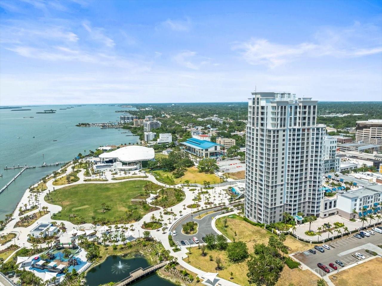 2 bed/2 bath Condo in Clearwater. High and Dry Hurricane Hardened Building in a non-evacuation zone high on a bluff overlooking Clearwater's Coachman Park, Marina, The BayCare Sound Stage, Clearwater Beach, Sand Key and Intra Coastal Waterway. Walk to the wonderful events at the BayCare Sound and Capitol Theatre both right across the street as well as multiple restaurants, coffee shops, etc... This is a custom finished Waters Edge 2 bedroom, 2 bath condo plus office/work space. It features amazing Northerly and Westerly water views of the Intracoastal, beaches & Gulf of Mexico. This condo features large windows to afford you the best views and bring in the natural light. The open kitchen great room plan gives a spacious feel perfect for entertaining and enjoying the beautiful views. A large covered balcony allows you to enjoy the fresh air and concerts featured at the Sound Stage! Master bedroom features a large window, master bath with dual sink vanity, walk in shower and separate large soaking tub. Separate laundry room and separated office space. Also, two convenient covered and secured parking spaces #15 & 16 as well as a storage locker #67. This unit has beautiful décor and is move in ready. The community features a gym, clubhouse, pool, BBQ, outdoor fire place area and is located with a front row view of the most spectacular sunsets!