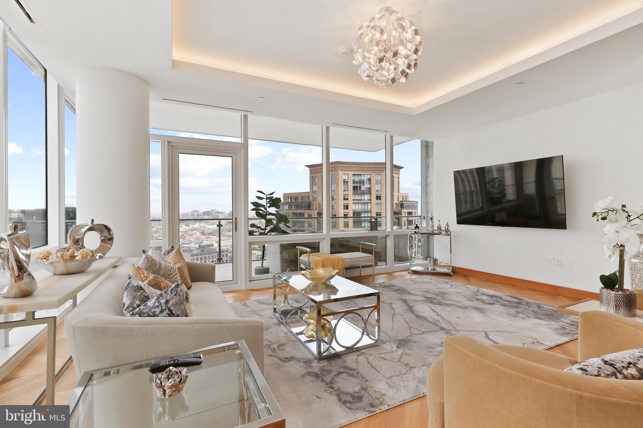 Price Refinement.  Breathtaking Panoramic views of the Inner Harbor from the most Luxurious Building, located in the most coveted Zip Code in Baltimore City, the Four Seasons Private Residences in Harbor East. This 2 Bedroom 2 Bathroom Residence, located on the 24th Floor, features an inviting Open Floor Plan with sprawling Chevron Walnut Wood Floors throughout and floor to ceiling windows in every room to ensure maximum exposure to sunlight and gorgeous views. The Custom gourmet Kitchen is perfectly appointed with Miele appliances and centered around an elegant waterfall marble countertop island that is open to the living space which includes an outdoor Patio where the dramatic views continue. The Primary suite is complete with dressing room and lavish en-suite marble bath w/ large walk-in shower and stand-alone soaking tub. Four Seasons 5-Star Amenities include a Residence Only front entrance and resident only amenities level which encompasses the entire 28th floor and the views continue. This private resident level includes an infinity edged Salt Water indoor heated pool with an open air rooftop Sundeck, a Sauna - complete with its own Harbor Views, fitness room, a large gathering and event space which consists of large dining area, lounge spaces, conference room, billiard area, kitchen space, indoor and outdoor fireplaces, multiple outdoor seating spaces, outdoor grilling area, and an outdoor AstroTurf dog walking space. Four Seasons Private Residences Baltimore, a seamless blend of sophisticated style, lavish amenities, and the exemplary service of the world's preeminent hotelier.