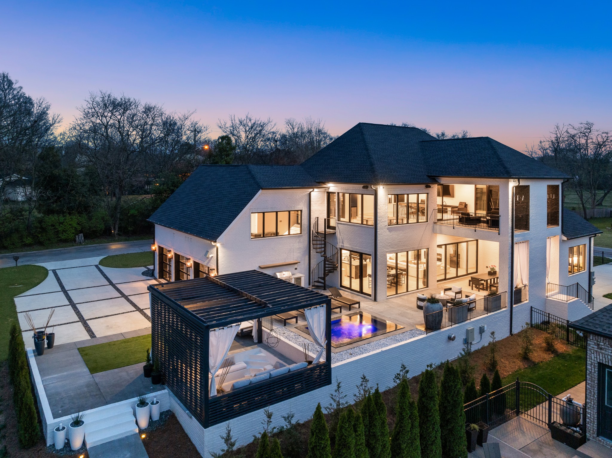 This is a MUST SEE!!  Custom built in 2023 by one of the area’s top builders, this residence is the epitome of luxury lakeside living. Enjoy 3 outdoor living areas, a private dock with boat lift and 2 jet ski lifts, and a newly installed flagstone path from the residence to the lake.  Sellers have installed a whole house generator, smart lighting, new uplighting on the exterior of the home, new natural gas outdoor sconce lighting, and new garden lighting. There is attention to detail in every room, with a spectacular theater room, recreational room, and 60+ bottle wine room.   This exclusive Davidson County neighborhood is the closest lakefront community to downtown Nashville and only 20 minutes from the airport. The showroom quality garage adds an additional 900 heat/air square footage.  Enjoy the best of both worlds with a lake property close to all downtown Nashville has to offer!  Call for your private tour today!