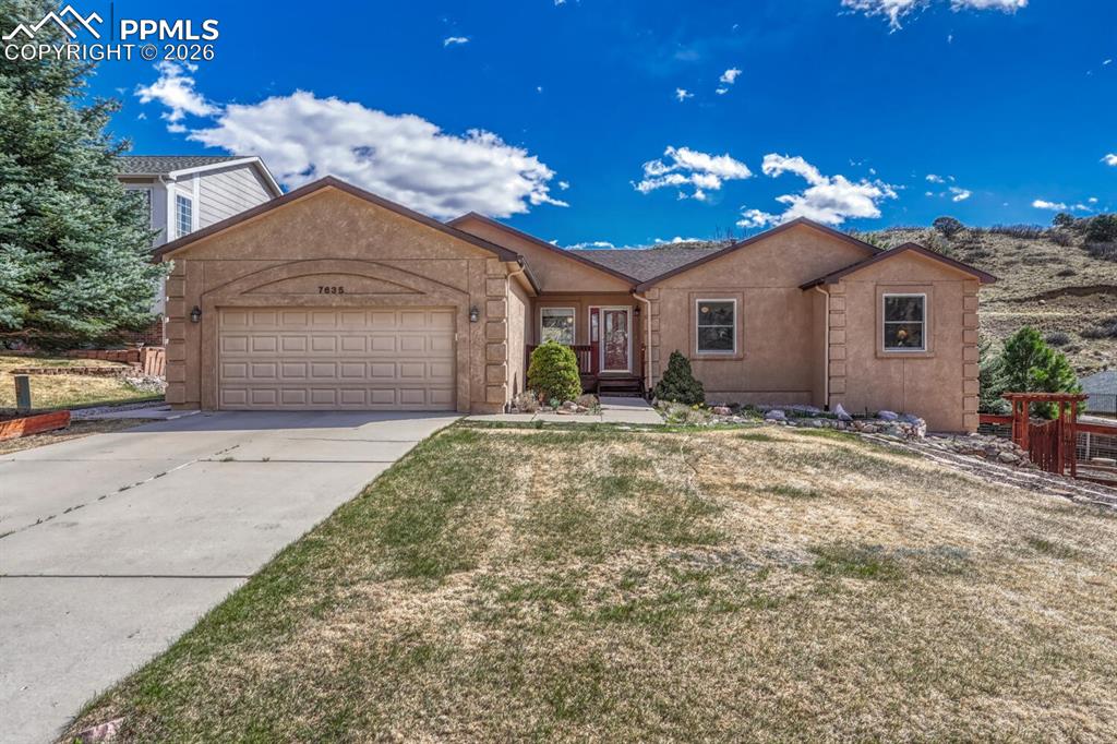 Enjoy main level living in this Oak Valley Ranch Home with Gardens and Mountain Views. Nestled in a coveted Northwest Colorado Springs foothills location, this stucco ranch with finished basement features 5 bedrooms, 3 bathrooms, and a 2 car attached garage on a rare .3 acre lot. You get nearly 2000sqft of living space on the main level, plus a walk-out basement! Nearby neighborhood entrance to Blodgett Open Space provides immediate access to 384 acres of City-owned open space with an extensive trail system! Updated kitchen features shaker-style cabinetry, granite counters, and stainless steel appliances, with vaulted ceiling, skylight, and breakfast nook. Formal dining room walks out to back yard. Vaulted ceiling and gas fireplace enhance the living room. Primary bedroom offers walk-in closet and en suite five-piece bath with upgraded cabinetry, granite, tile, and soaking tub. Second and third bedrooms, full bathroom, and laundry room complete the main level. Enjoy mountain views from most main level rooms! Finished basement includes family room, two bedrooms, a bathroom, and a finished storage area with cabinetry, countertop, and space for a refrigerator. Glass French doors lead to workshop, which includes utility sink, storage space, counter space, and walk-out to the yard. This has served as the potting room for the household gardener. You’ll love the wonderfully landscaped yard, which includes a variety of colorful plantings, raised garden beds with drip system, lawn with auto sprinklers, trees, shrubs, and more. The yard is fully fenced, and back deck features mountain views. The home has central A/C and Andersen windows. The location is just a few blocks to Oak Valley Ranch Park and playground. Wilson Ranch Park is also nearby with a swimming pool, tennis court, roller rink, and more. Enjoy quick access to hiking trails at Ute Valley Park and Rockrimmon Open Space. For main level living in Northwest Colorado Springs, this Oak Valley Ranch home can’t be beat.