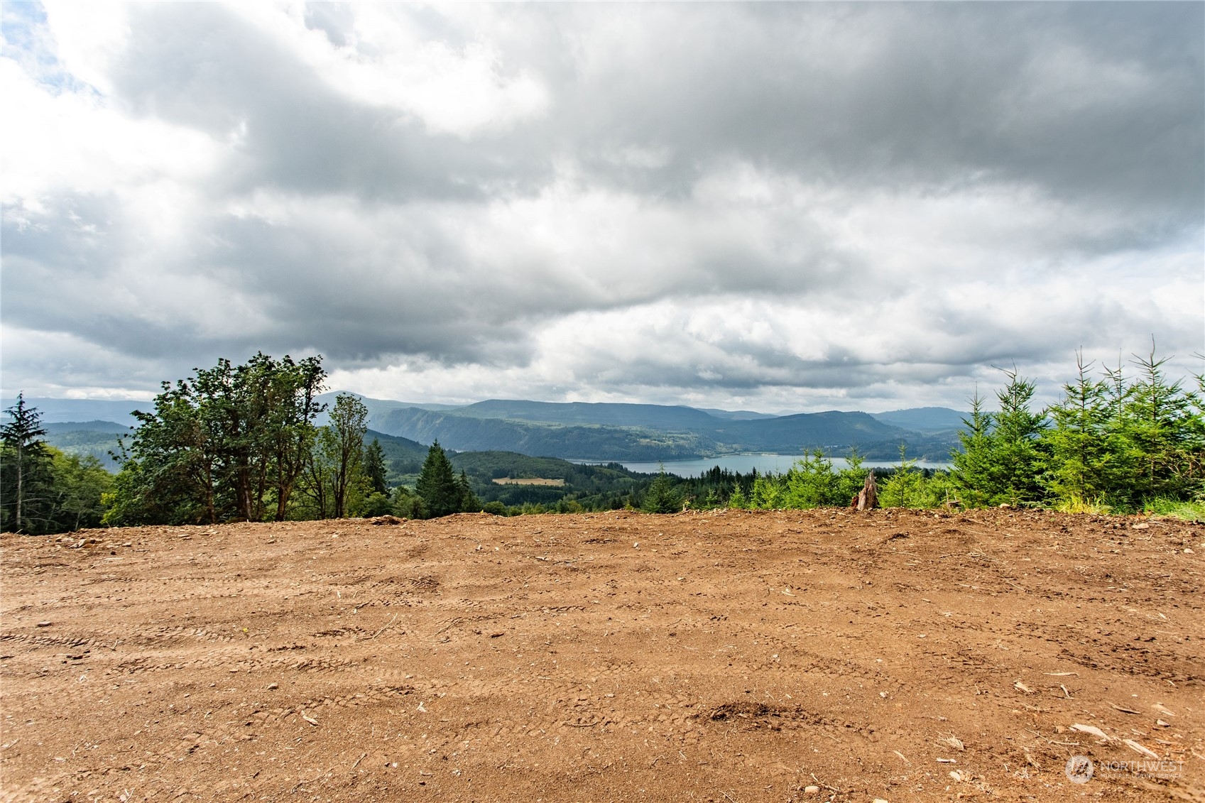 Down a remote county dead end road, climb to the top of your property and put your forever home over looking Riffe Lake and the surrounding foothills. Truly a unique property that offers million dollar views. Nestled under a large timber company, this 6 acre parcel offers maximum seclusion. Road is roughed in and  Building pad is made and ready for your building plans. No CCR's or rules telling you what you can or can't do. Live rural on this piece of land. Elk, deer and other wildlife frequent the property!