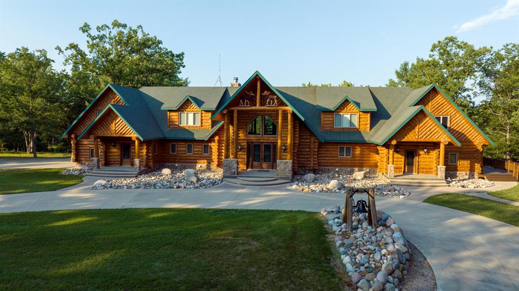 Whitetail Properties is proud to present this truly special property in Northern Michigan, over 475 acres of pristine property with miles of trails and roads and one of the most spectacular log homes we have ever had the privilege of bringing to the market.As you enter through the large gated entry, a long, winding, manicured gravel road takes you back to one of the most beautiful and well-built custom log homes you will ever see. Built by one of the most reputable and talented log home builders, this log home is like something out of a movie or a magazine. With just over 10,000 sq. ft. of living space among 3 levels, this home has it all.