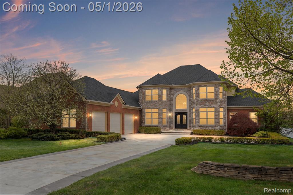 Welcome to one of Hidden Lake’s premier waterfront opportunities. Perfectly positioned on a coveted lot with over 100 feet of frontage, this exceptional custom residence offers sweeping unobstructed views of the main lake, marina, and amphitheater.Extensively improved and thoughtfully updated, this luxury waterfront home offers over 6,000 finished square feet designed for elevated everyday living and entertaining. The main level features an updated chef’s kitchen that flows seamlessly into the expansive great room with soaring ceilings, oversized windows, abundant natural light, and breathtaking lake views. A stunning lakeside sitting room offers the perfect retreat for morning coffee or sunset evenings.The highly sought-after main-floor primary suite includes a custom walk-in closet, renovated spa-inspired bath, and peaceful water views.The finished walkout lower level is an entertainer’s dream—featuring a large projector media area, second kitchen, fitness space, additional bedroom, full bath, and generous room for hosting family and guests. A rare and standout amenity is the private indoor wellness swim spa with Fastlane system—bringing year-round health, fitness, hydrotherapy, and recovery home while creating a private wellness retreat unlike anything else currently available.Recent improvements include a new roof, HVAC systems, windows, driveway, front porch, carpet, paint, iron front entry door, hot water heater, epoxy-coated heated garage floors, and whole-house Generac generator. Outdoor amenities include premium hardscaping, outdoor kitchen, expansive natural gas firepit, private dock, private beach area, and lakeside volleyball court. Enjoy Hidden Lake’s gated lifestyle with marina, trails, beach, amphitheater events, and convenient access to Brighton, Ann Arbor, and US-23.