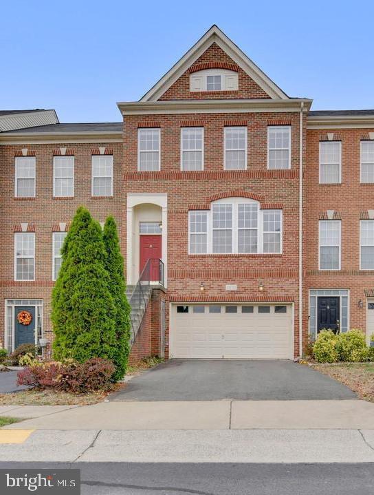 Absolutely stunning  Brick  Front 3 Level TOWNHOME   sought after Stone ridge community.  **** Roof -2023, New A/C, Carpet-2021, Water Softner-2021, Paints-2021, Deck-2021.**** This gorgeous home features are 3 bedrooms, 3 full baths, 1 half baths and 2 car garage,  sleek modern Luxury Chef's Kitchen, stainless steel appliances, upgraded cabinets ,  Fireplace,  and  Entire house with LED lightning. Upstairs, the primary suite provides a  spa-inspired bathroom with dual vanities, Tub, and an oversized shower enclosure with a built-in seat. A beautiful backyard with a large Deck and Patio. This home Located within the highly sought-after Stone ridge Community offers residents access to walking trails, parks, playgrounds, swimming pools. Just .5 miles away abundance of shopping, dining, Banks and entertainment options, ensuring a lifestyle of both comfort and convenience. Easy access to Park & Ride, Dulles Airport, Shopping, Commuter Routes and Metro Rail.