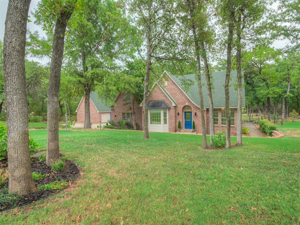 Tucked behind the gates of Oakmont, this beautifully situated home offers the privacy, space and wooded setting that is increasingly hard to find in Oklahoma City. Set on an expansive lawn with an established canopy of trees, this 4-bedroom home offers a peaceful, almost country-like atmosphere while remaining convenient to Edmond and Oklahoma City.Inside, warm hardwood floors, abundant natural light and architectural details create an inviting atmosphere. The kitchen features white cabinetry, granite countertops, stainless steel appliances and a professional-style FiveStar gas range. The living room is anchored by an updated fireplace, while large windows frame views of the beautiful surroundings.The spacious downstairs primary suite features hardwood floors and a private bath with dual vanities, soaking tub and large tiled shower. Three additional bedrooms upstairs provide flexibility for family, guests, an office or hobby space.And then there's the backyard. A recently redone deck and multiple outdoor living areas overlook a sweeping lawn framed by beautiful trees, creating a wonderfully private setting. There's plenty of room for morning coffee, outdoor dining, entertaining friends or simply relaxing and enjoying the peaceful surroundings.Located in the sought-after Oakdale School District, this is a beautiful place to enjoy everyday life—inside and out.