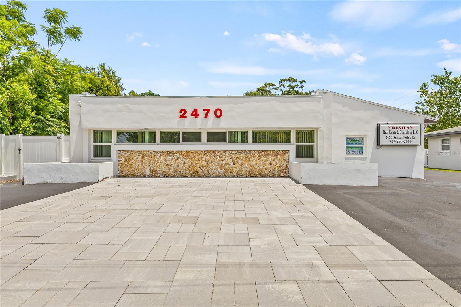 Under contract-accepting backup offers. Location, Location! Excellent Visibility from Sunset Point. STAND ALONE. NO FLOOD ZONE. No Evacuation Zone. Centrally located 2 blocks from US Highway 19 N. Great visibility. Completely updated Office building ADA compliance for Sale or Rent. Free Standing 1870 Heated square feet. 1030 -EXCHANGE. NEW ROOF SEPTEMBER 2024, ASPHALT 2024, ASPHALT SEALCOATING 2025. A/C DECEMBER 2024, FRONT BUILDING WINDOWS DECEMBER 2024. FULLY EQUIPED NEW KITCHEN  JANUARY 2025, SMART DISHWASHER, JANUARY 2025, BATHROOM 2025, FENCE JANUARY 2025. ELECTRIC BOX 2025. WASHER & DRYER LG BRAND  2025 with SMART FEATURES, BACKYARD TILED WITH A SEPERATE SMOKING AREA. GUEST AREA BY THE FRONT FDOOR FOR GUEST TO RELAX. WATING AREA AS YOU WALKING FURNISHED AND SMART TV . Office offers 2 bathrooms. 1 Guest and 1 full  bathroom with shower. Conference room comes all furnished along with 65-inch smart TV. Building includes 5 separate offices, kitchen and additional large storage room including latest stackable smart washer and dryer for convenience. 12 parking spaces on the back.  Place your business name on the building.