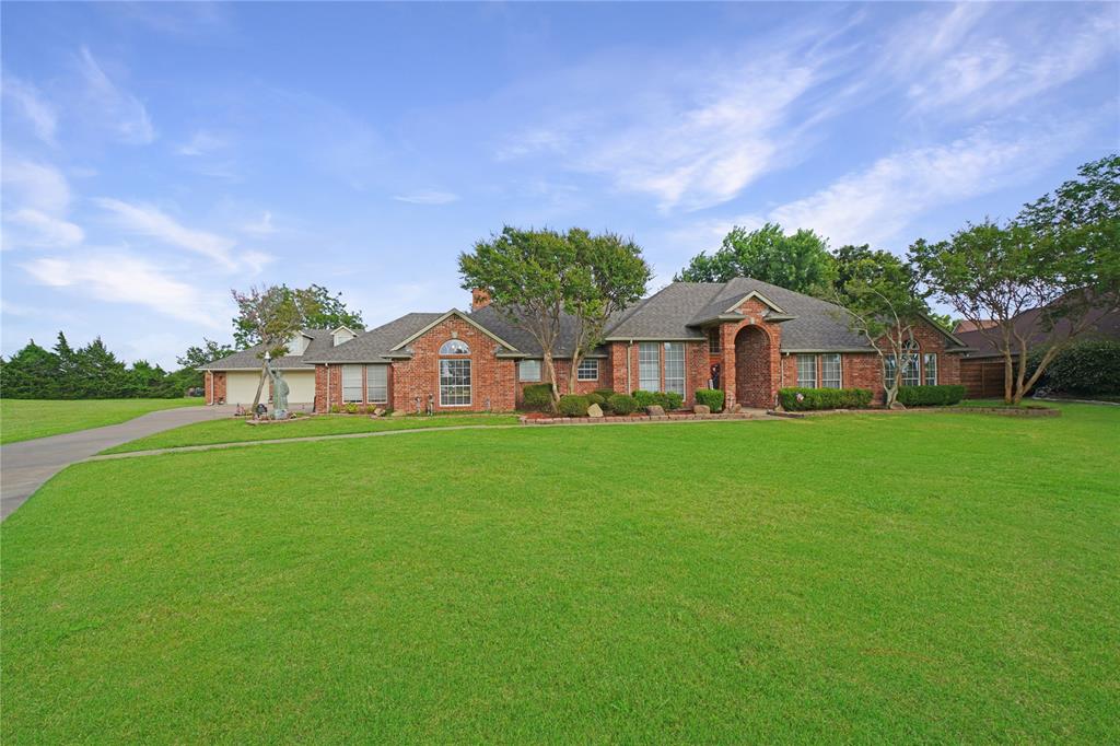 Is there a spacious 4-bedroom home on acreage in Rockwall with room for guests, hobbies, vehicles, and entertaining? Welcome to 2152 Chisholm Trail, a beautifully maintained 4-bedroom, 3-bath residence offering 3,165 square feet of living space on a picturesque 1.5-acre lot. This exceptional property combines comfort, functionality, and outdoor living in a highly desirable Rockwall location.Step through the impressive entry and discover hardwood and ceramic tile flooring, soaring ceilings, rich crown molding, recessed lighting, ceiling fans, and abundant natural light streaming through large windows. Multiple living areas include a formal living room, spacious family room, and formal dining room, creating flexible spaces for everyday living and entertaining.The kitchen is designed for gathering, featuring custom cabinetry, generous counter space, a convenient snack bar, and a bright breakfast area overlooking the backyard. A large utility room adds everyday convenience.The primary suite offers a relaxing retreat with a spacious bath, dual vanities, and a large walk-in shower. Three additional bedrooms provide room for family, guests, or home office needs.Outdoor living shines with a large covered patio and pergola overlooking the professionally landscaped grounds and expansive lawn. The fully fenced 1.5-acre property provides plenty of room to enjoy outdoor activities, gardening, or simply taking in the peaceful surroundings.Car enthusiasts, hobbyists, and remote professionals will appreciate the attached 2-car garage plus a detached 2-car garage complete with a full bath and large office or guest living area. This versatile space offers endless possibilities for a home business, studio, workshop, guest quarters, or additional recreation space.With low HOA dues of only $100 annually, a desirable Rockwall location, and ample room to work, entertain, and roam, this one-of-a-kind property delivers the space and flexibility buyers desire.