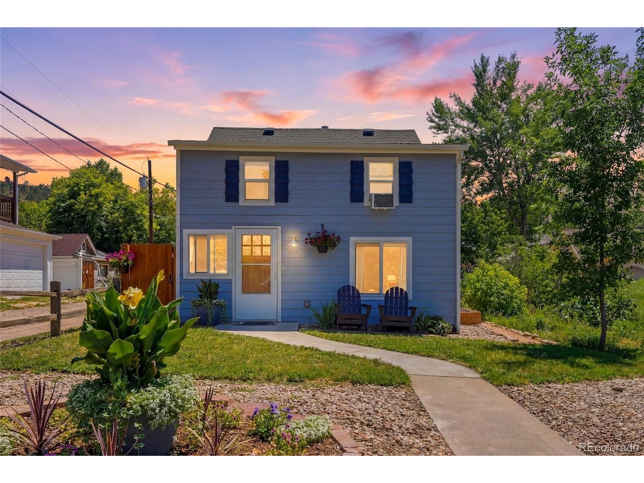 Wake up to mountain views and creek sounds from a home perched right across the street from Lyons' town park, where the creek that runs through downtown is practically your front yard. Coffee on the patio, then a stroll of just a couple of blocks into downtown for shops and restaurants, an afternoon at the local dog park, or an adventure onto one of the many hiking trails minutes away in any direction, this address puts it all within reach. Character fills every corner inside: a dining room warmed by a cozy fireplace with a pellet stove, a living room where laminate meets rich hardwood floors, and a kitchen with plenty of room to gather and cook. A main-level bedroom and full bath bring easy flexibility, while upstairs two more bedrooms await, including a primary suite with a walk-in closet, alongside a three-quarter bath. The 3,070-square-foot lot creates a private outdoor escape complete with mountain views and a detached one-car garage. Whether you're settling in for good or eyeing a short-term rental, this one plays both roles beautifully. The Seller is offering $15K in Seller Concessions!