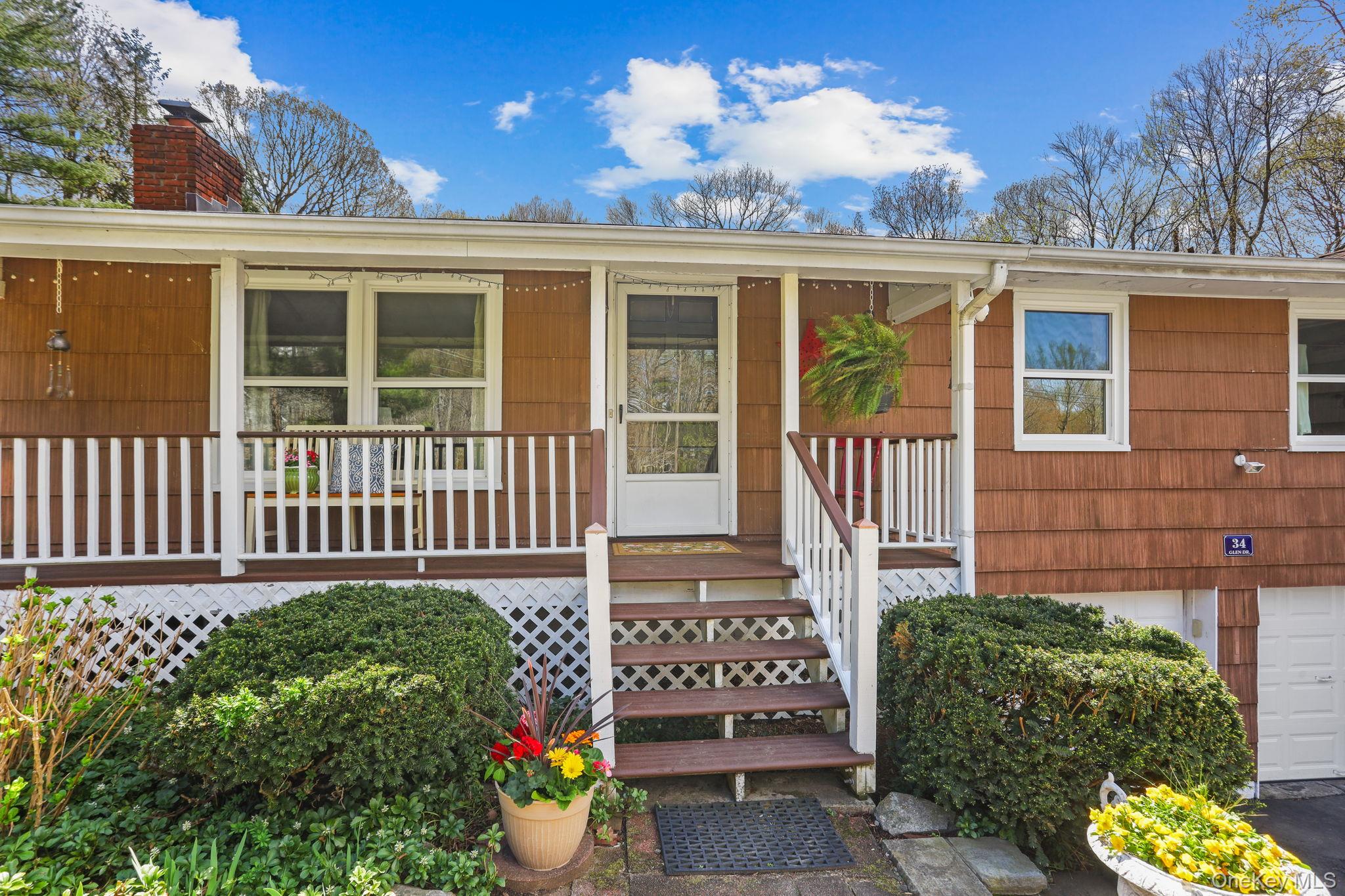 A Sprawling 2.68 Acre Haven with Majestic Rock Gardens!Discover this beautiful, private Ranch-style home nestled on 2.68 tranquil acres. This property offers a perfect blend of peaceful seclusion and versatile living spaces, all surrounded by stunning, mature landscaping. Exquisite Outdoor Sanctuary.The expansive, professionally landscaped grounds feature mature plantings, majestic rock gardens, stunning stone wall settings, a relaxing exterior patio, and a cozy fire pit area. Enjoy seamless indoor/outdoor living with a charming covered front porch and a screened porch—perfect for enjoying private views or escaping hot, buggy nights. The home offers peace of mind and has been nicely maintained with a thoughtful Interior Layout.Step inside this classic Ranch home to find a well-maintained layout showcasing sun-drenched rooms and hardwood floors throughout. The Living Room is anchored by a fireplace creating a warm ambiance. The Eat-in Kitchen features a large window with tranquil views of the backyard setting. Versatile Living.With a total of nine rooms, there is ample space for family gatherings and private retreats. The home offers 3 bedrooms plus a den, 2 full and 1 half bathrooms, including a Primary Suite with bath. The layout includes a spacious Family Room, which functions as an accessory apartment complete with French doors that open directly to the beautiful back yard. Additional space is found in the  walk-out lower level with windows, offering even more flexibility.This peaceful, private setting on 2.68 acres offers something unique in every season, and is conveniently located close to local restaurants, shopping, schools, and commuter trains.