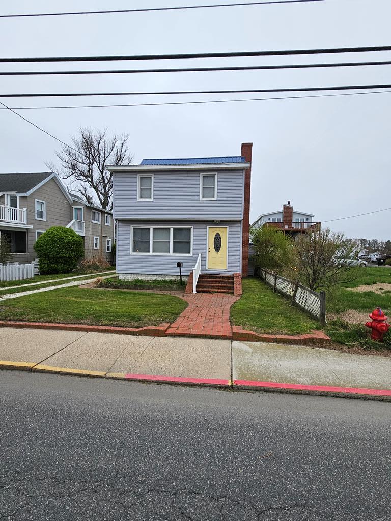 PRICED WAY BELOW RECENT ASSESSMENT!!!! PRICED TO GO! THIS MAIN STREET PROPERTY IS JUST CHARMING-FORMER BEEBE HOUSE.  YOU WILL LOVE THE HARDWOOD FLOORS THAT ARE REAL, COZY WOOD BURNING FPL. W/INSERT FOR THOSE CHILLY NIGHTS IN LARGE LIVING ROOM, RELAX IN THE CONVERTED FRONT PORCH FOR GAME NIGHT AND WATCH THE AWESOME SUNSETS, KITCHEN HAS BRAND NEW STOVE & REFRIGERATOR W/CENTER ISLAND-TONS OF CABINETS SPACE WITH ACCESS TO PATIO FOR COOKOUTS, SEPERATE DR.,, 3 LARGE BEDROOMS. FULL SIZE W/D, FRESHLY PAINTED. MANY UPDATES,  LARGE SHED IN BACKYARD WITH ELECTRIC CONVEYS. DON'T MISS THE "BOAT HOUSE"-IDEAL FOR STORAGE OR KIDS PLAY CENTER-IT'S ACROSS THE ST. ON WATERFRONT. PIER SOLD "AS IS" CONDITION-570' PIER LONG-DEEP WATER-DO NOT GO OUT ON IT!.  FROM UP TOP OF BOATHOUSE-WATCH THE ROCKETS GO OFF!!