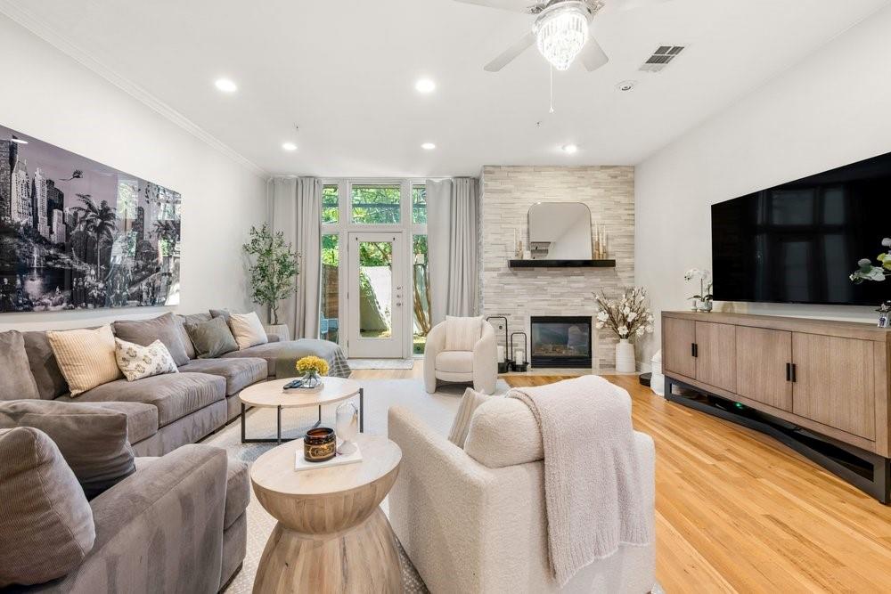 Tucked beneath a canopy of mature trees on one of Turtle Creek’s most charming residential blocks, this beautifully updated three-story corner condo feels wonderfully private and removed from the city—while placing some of Dallas’ best parks, trails, dining and nightlife just outside your door.Warm, inviting and full of character throughout, the home has a wonderful sense of charm and privacy across all three levels. On the main floor, a large, updated kitchen with stainless steel appliances overlooks the spacious living area, where a beautiful fireplace creates a natural focal point. From there, doors open to a private, shaded and turfed backyard—an unexpected outdoor retreat perfect for morning coffee, entertaining friends or unwinding at the end of the day. The second-floor primary suite is a true escape, complete with a charming Juliet balcony and a spacious ensuite bath featuring a jetted tub and separate walk-in shower. An exceptionally large walk-in closet with an extensive custom organization system offers incredible storage and makes keeping everything in its place effortless. Upstairs, the third floor offers two additional bedrooms with a shared bath, while each bedroom enjoys its own private vanity. One opens to another Juliet balcony overlooking the community’s Spanish-tile rooftops—a picturesque view that feels more like a hidden European courtyard than the heart of Dallas. The home also features updated HVAC, a private parking garage with two dedicated spaces and a separate storage unit, plus ample street parking for guests. Beautiful Turtle Creek Park and the Katy Trail are just a short walk away, along with the restaurants, cafés, shopping and nightlife of Oak Lawn and Uptown. It’s a rare combination: genuinely walkable city living with the quiet, shaded and secluded feeling of a residential retreat. Updated, private and undeniably charming, this is Turtle Creek living at its best.