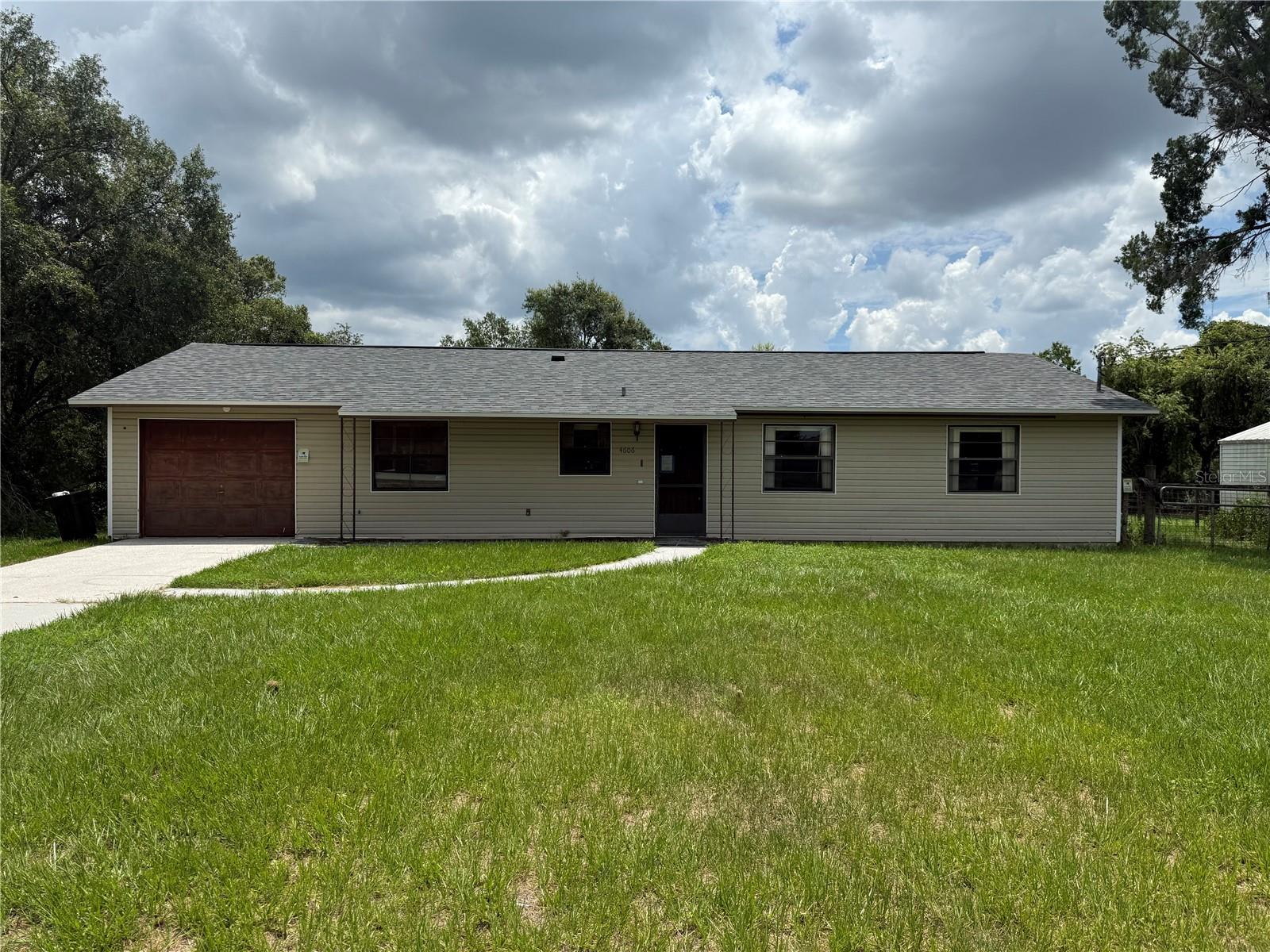 Three bedroom, two bath home on 1.7 acres with views and partial ownership of a large pond, and conveniently located just 10min from I-75, shopping, grocery, retail and more.  BRAND NEW roof and HVAC.  The layout and bones of this house are great, and there is ample upside potential for the buyer after completing a mostly cosmetic update to their own tastes.  Large AC'd utility room.  Septic was just inspected and pumped, and the well is operating great but minor improvements are recommended.  Plenty of land to build storage sheds to store tools, equipment, boats and RVs.  Would make a great home or rental property.