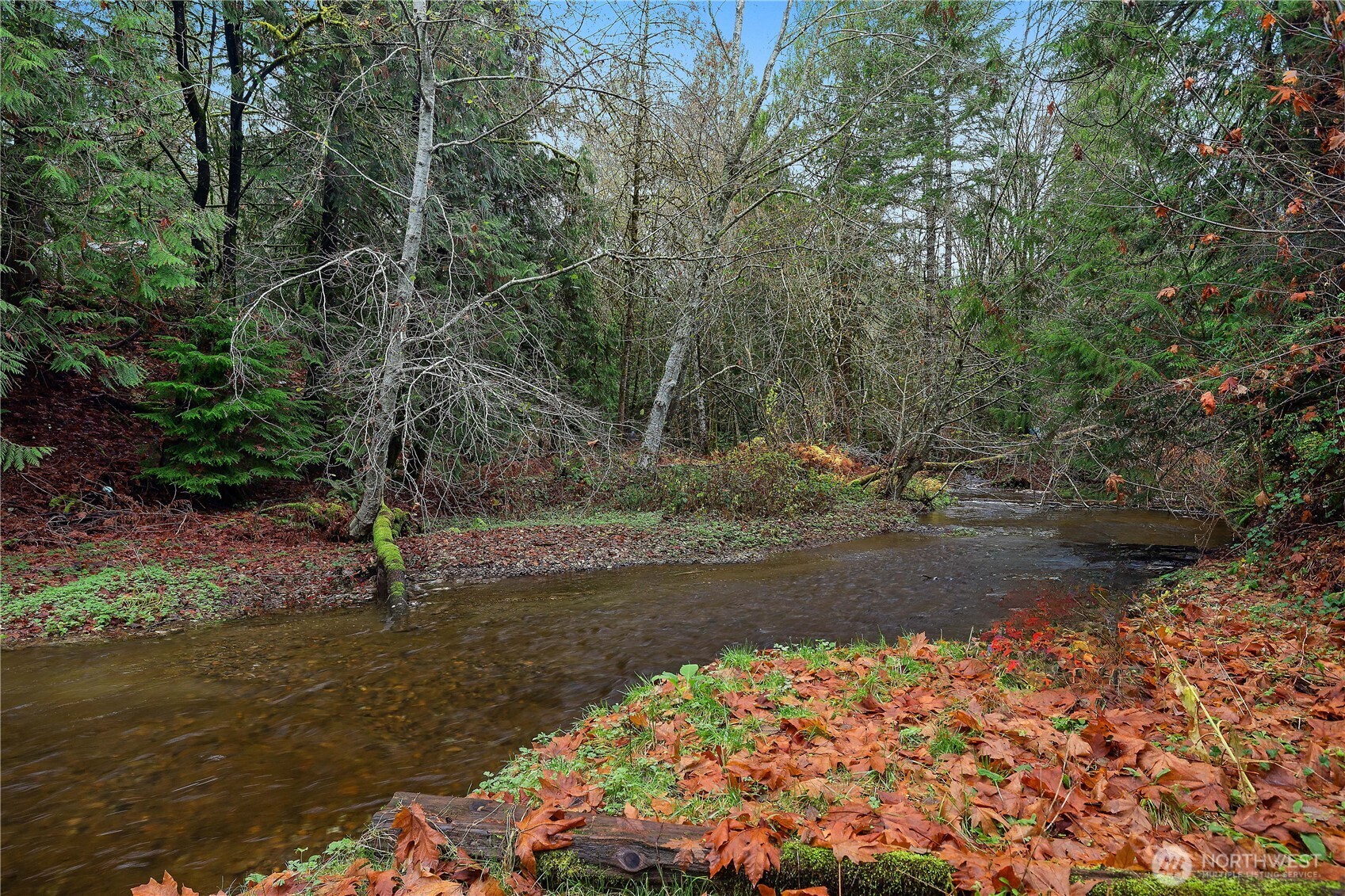 Desirable Lake Limerick community opportunity! This 3-bedroom, 2-bath manufactured home sits on a spacious lot-and-a-half, backing to scenic Cranberry Creek. A peaceful trail leads to the water’s edge, where you can enjoy the calming sounds of the creek year-round. Relax in your private backyard surrounded by mature fruit trees and natural beauty—an ideal setting for quiet mornings or evening gatherings. Sold AS-IS; personal furnishings and belongings will be removed prior to closing. Located in the sought-after Lake Limerick community, residents enjoy access to two lakes, boat launches, swimming areas, parks, trails, a 9-hole golf course, and year-round community events. A wonderful chance to own in a vibrant, amenity-rich neighborhood.