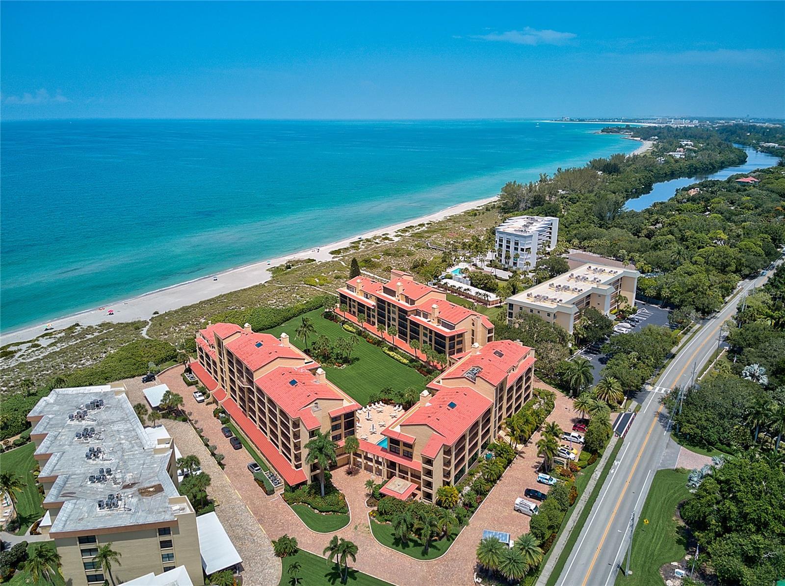 Siesta Key dream condo located directly on the Gulf of Mexico, offering deeded beach access and boat slip availability on the Intracoastal Waterway just across the street. This inviting one-bedroom residence features quartzite countertops in both the kitchen and bath, along with a new kitchen backsplash that adds a fresh coastal feel. A highly desirable in-unit washer and dryer—an upgrade not found in all units—provides added convenience. Residents enjoy a wide range of resort-style amenities, including a heated indoor/outdoor pool, sauna, tennis and pickleball courts, shuffleboard, and a fishing pier. The community has recently completed major improvements, including a new roof, freshly painted buildings, and a refreshed pool, with all assessments fully paid. The updated clubhouse features a full kitchen and dining area and may be reserved for private gatherings. Impact-resistant windows and doors offer peace of mind, and beautiful Mexican tile throughout means no carpet. The unit is being sold turnkey furnished, excluding select personal items, and offers ample storage along with an assigned covered parking space and plenty of guest parking. Located just one floor up, access is easy via elevator or stairs, placing you moments from the world-famous quartz sands of South Siesta Key. Enjoy a trolley ride to Siesta Key Village or a bike ride to charming shops and restaurants. Conveniently located near cultural attractions and Sarasota International Airport. Rentals are permitted with a one-month minimum, up to three times per year. No pets allowed. Relax and enjoy the effortless coastal lifestyle this private Siesta Key retreat offers.