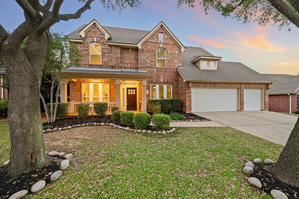 Welcome to this beautifully maintained home featuring a charming covered front porch and inviting curb appeal, enhanced by fresh landscaping located just minutes away from DFW Airport and Grapevine Lake, the location can't be beat! Inside, you’ll find fresh paint throughout, new carpet, luxury vinyl plank flooring and tile flooring in the entry, walkways, kitchen, and sunroom, creating a clean and updated feel from the moment you walk in. The home offers elegant formal dining and a versatile formal living or study, along with a spacious den anchored by a cozy gas log fireplace. The den flows seamlessly into the gourmet kitchen, complete with solid surface and quartz countertops, an eat-in area, and an updated cooktop (2025). A bright sunroom adds additional living space, perfect for relaxing or entertaining. The large primary suite downstairs provides a private retreat with an updated spa-like bathroom featuring a separate shower, and a custom California Closet system. Upstairs, you’ll find three generously sized bedrooms, a game room, and a hidden bonus room, along with abundant storage throughout. Additional highlights include a tankless water heater, two HVAC systems, premium windows, and a roof replaced in 2021. Thoughtfully updated and move-in ready, this home offers the perfect blend of space, comfort, and functionality.