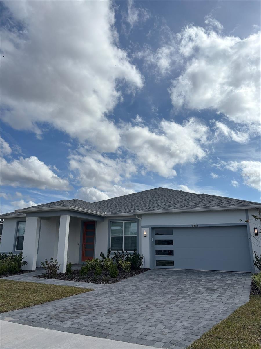 Under Construction. EverBe is a new master planned community where convenience and connections combine to create a new standard for home. Located in Orlando with quick access to 417 & 528, this lifestyle community will offer miles of pathways & trails, wi-fi-enabled green spaces, unique outdoor recreation areas, a fitness center, a clubhouse complex with resort pool, 2G internet, and a waterfront amenity and town center. Get excited for EverBe - everything home should ever be!Discover the perfect blend of luxury, comfort, and convenience with the stunning Mahogany home by Pulte. This one-story 4 bedroom with flex room, 3 bathroom, 2 car garage plus storage home offers everything you need for an effortless lifestyle. The open concept living area flows effortlessly, combining the kitchen, café, and gathering room into one expansive space that feels airy and inviting. Soaring tall ceilings and a luxurious double tray ceiling elevate the entire area, adding a sense of grandeur while maintaining an intimate, welcoming atmosphere perfect for entertaining. The pocket sliding glass doors, which connect the living area to the covered lanai, flood the home with natural light, creating a bright, vibrant environment that brings the outdoors in. The heart of the home is the chef-inspired kitchen, where 42" White cabinetry with brushed nickel hardware meets luxurious quartz countertops. Thoughtfully designed features like soft-close drawers, easy-reach corner cabinets, double roll-out trays, and a waste basket drawer make the kitchen as functional as it is beautiful. A decorative tile backsplash, granite single-bowl sink, and upgraded faucet enhance the space, while the built-in Whirlpool stainless steel appliances—including a refrigerator and range hood—ensure you have everything you need for both everyday meals and special occasions. The private Owner’s Suite, located at the back corner of the home for ultimate privacy, offers a tranquil retreat with a spa-inspired en suite bathroom, oversized walk-in closet, linen closet, glass enclosed shower, and enclosed toilet. The flex room offers a versatile space that can be used as an office, home gym, or playroom. The Mahogany also features two spare bedrooms located in the opposite back corner of the home and a third spare bedroom at the front of the home, allowing privacy for everyone. A 2-car garage with storage space provides plenty of space for vehicles, storage, or hobbies. Don't miss the chance to see this home today!