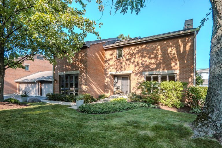 Park Lane's Townhouse #33 is one of the most desirable townhomes in Park Ridge. Located in the prestigious 24-hour gated community, this light-filled end unit, tucked into the back corner of the complex, features the finest high-end finishes and amenities, surrounded by lush gardens with a huge side yard, backyard, and patio. Views of Murphy Lake from first and second floors.      The De Giulio Kitchen features Costa Esmeralda granite countertops, Sycamore wood cabinets, Wolf, Miele, and Sub-Zero appliances. Kitchen eating area, adjacent to dining room, all with garden views.     The living room features three walls of windows with garden views and a gas fireplace with a new custom mantel.     The primary bedroom has a sitting area with a large ensuite bath featuring an oversized whirlpool tub, separate shower, wall-to-wall closets, marble flooring, granite counter tops, and skylight.     More features to love: Private entrance, Brazilian cherry hardwood floors, and travertine marble floors. Newer Anderson windows and glass sliding doors, high-efficiency furnace, hot water heater and A/C, all Toto toilets, new ceiling fans, new washer and dryer. Custom sconces, light fixtures, and window coverings. Skylights let in lots of natural light. Custom marble bar and wine fridge in lower-level family room. Plenty of storage and closets throughout.     Park Lane offers luxurious, resort-style living with a beautiful swimming pool with deck and grills, new pickleball and tennis courts, an exercise room, and gorgeous landscaping. Cook County Forest Preserve is across the street.    Park Ridge is widely known for its Award-winning schools.