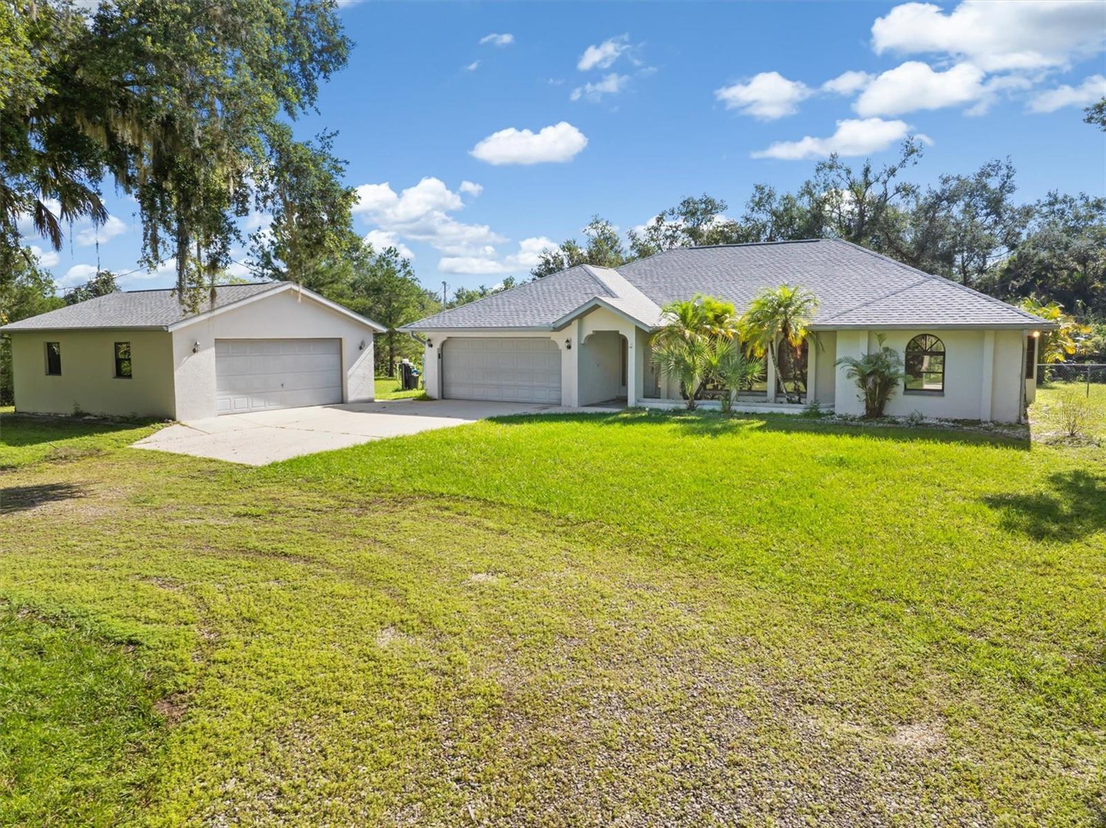 Old Florida Charm on 3.05 Acres – Updated Home with Pond, Additional Detached Garage/Workshop & More – North Port, FL

Step into the peaceful charm of Old Florida living with this beautifully updated home nestled on 3.05 acres of agricultural-zoned land in North Port/Sarasota County. Surrounded by nature and privacy, this property offers the ideal blend of rustic charm and modern convenience.

Inside, you'll find 3 Bedrooms, 2 Full Bathrooms, 1983 Square Feet of living area, a fully updated kitchen with tasteful finishes and all new appliances, perfect for home-cooked meals and entertaining. The home features brand new luxury vinyl plank flooring, a new A/C system 2025, new roof 2025, freshly painted interior, new ceiling fans, new light fixtures, and new hot water tank 2025— all the major upgrades have been done for you!

Another great features is the expansive screened-in lanai, ideal for enjoying Florida’s natural beauty in comfort — whether sipping your morning coffee, relaxing in the evening breeze, or entertaining friends and family.

The property also includes an additional large detached garage, offering ample space for a workshop, storage, or your recreational toys. A peaceful pond adds to the scenic charm and offers a perfect touch of tranquility.

With agricultural zoning, there’s room to create your dream lifestyle — bring your animals, plant a garden, or simply enjoy wide-open space with NO HOA restrictions and NO FLOOD INSURANCE REQUIRED! Click on the 3-D interactive video to immerse yourself in this beautiful home!
