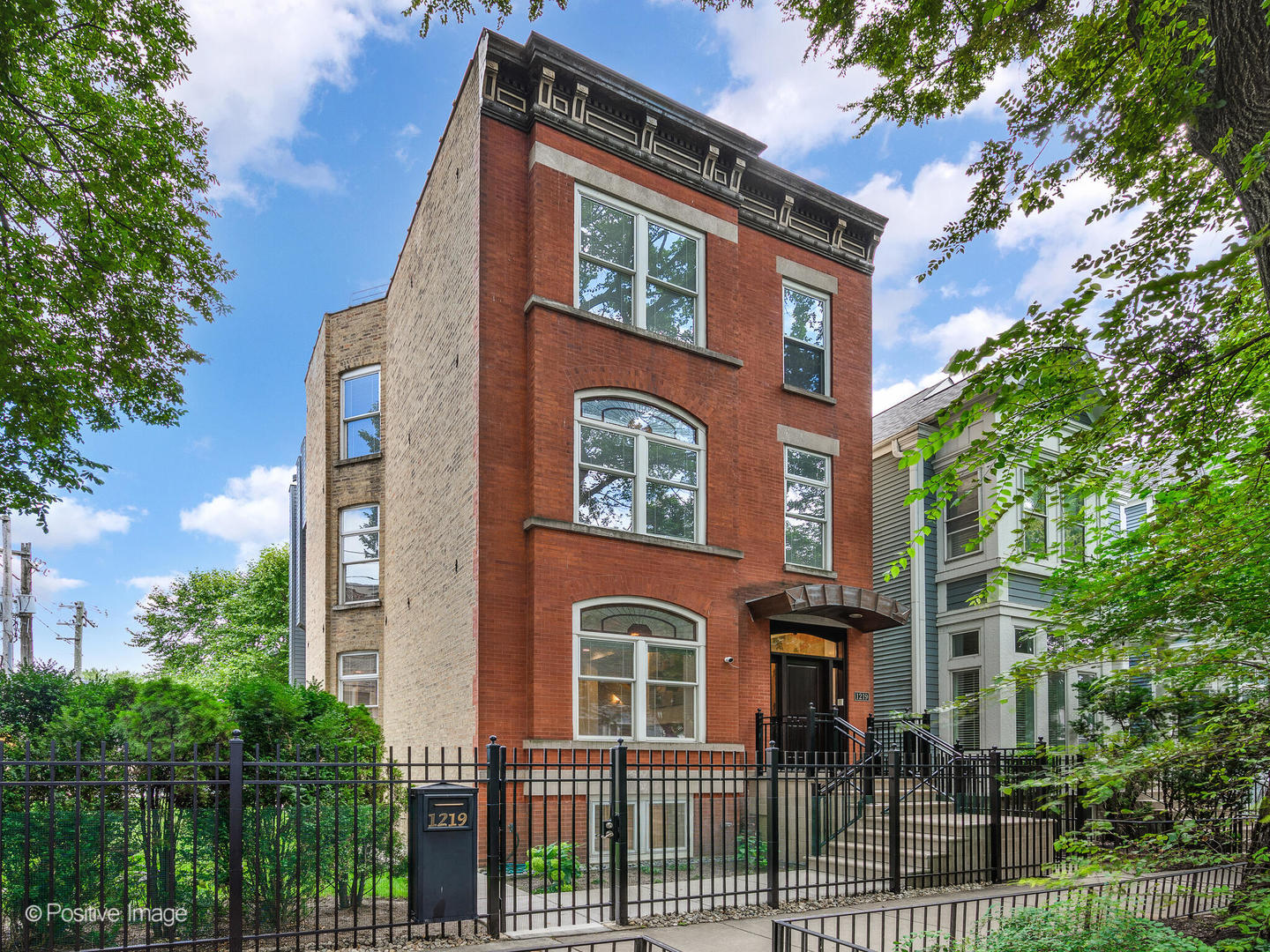 Sensational, rarely available 50' wide lot opportunity in the heart of Lincoln Park. This quintessential Chicago home has been meticulously maintained, boasts three outdoor spaces, and includes a private full-lot side yard with a Sport Court. You are welcomed by an elegant and inviting foyer, which leads to a light-filled living room and dining room-both with tray ceilings and crown molding-that overlook your private side yard. Tall windows and 10' ceilings provide abundant space and natural light. The gourmet kitchen offers endless counter and cabinet space, paneled appliances, a professional-grade gas stove, two dishwashers, and an 8-foot-long island. Extending from the kitchen is a spacious area that can function as a family room or casual dining space. Floor-to-ceiling, south-facing windows lead to a large outdoor patio, complete with a custom built-in grill station and cabinetry with integrated lighting, an exterior fireplace, and an outdoor TV-all perfectly shaded under eight towering river birch trees, ideal for summer entertaining. The second floor hosts the main bedroom suite with its expansive ensuite bathroom and dressing room. Also on this floor are a laundry room and a second bedroom with an ensuite bathroom. The third floor features two additional bedrooms-one with its own ensuite bathroom-and an elegant library/office, which centers around a large fireplace, custom-built cherry bookcases, cherry hardwood floors, and a building-wide balcony. The top floor of the home showcases a sunroom, a wet bar, and access to the massive rooftop deck that runs the length of the house, affording spectacular city skyline views and breathtaking sunsets. The lower level continues the spacious home with an enormous family room or rec room, additional storage, hookups for a second laundry room, a mudroom with a private exit to the side yard, and a fifth bedroom with an ensuite bathroom-ideal for guests or an au pair. Situated on tree-lined streets in one of Chicago's most desirable neighborhoods, this home is steps from parks, shops, restaurants, and top-rated schools.