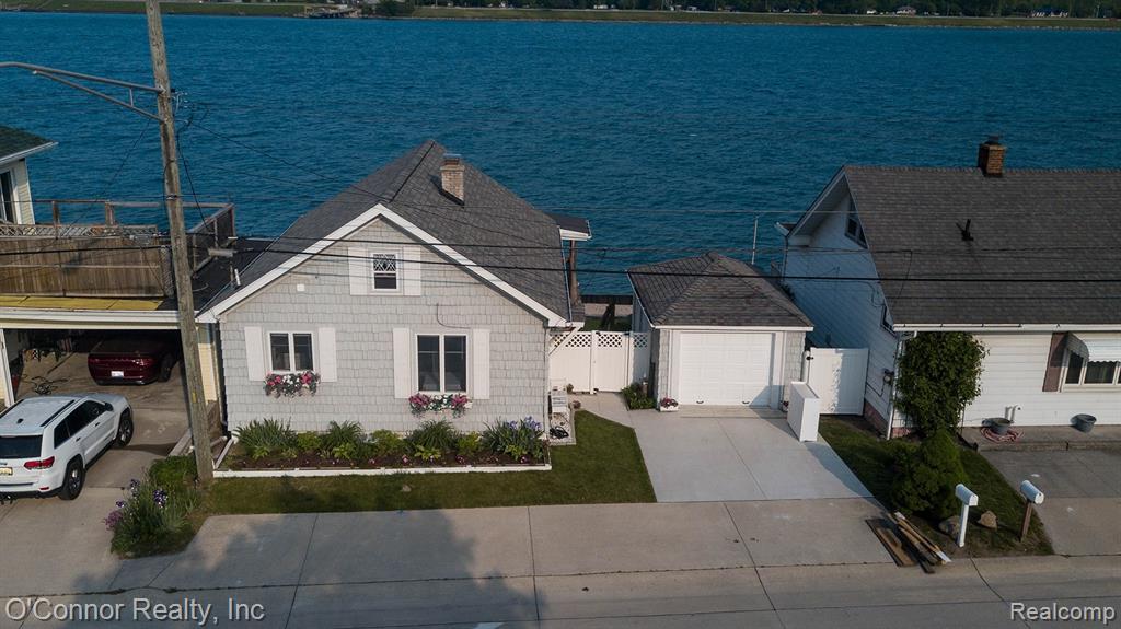 Your Affordable Riverfront Dream Starts Here!Here’s your chance to own a slice of paradise on the beautiful St. Clair River—at an affordable price! Imagine relaxing on your covered porch any time of day, taking in stunning river views and watching boats pass by… it truly doesn’t get better than this. This charming bungalow has been thoughtfully updated, so you can move right in and enjoy. Major improvements include a brand-new steel seawall, new roof, new furnace, updated electrical, new concrete driveway, and a new garage floor—just to name a few. The main floor features a spacious living room with breathtaking river views, a primary bedroom overlooking the water, and a completely remodeled bathroom with a walk-in shower. The kitchen offers ample cabinet space, all appliances included, and a cozy dining area. Upstairs, you’ll find a large bedroom with extra closet space plus an additional room—perfect for storage, a home office, or flex space. The fully finished walkout basement is ideal for entertaining, complete with a family room, bedroom, full bath, and a second kitchen—making it perfect for guests or gatherings after a day on the river. Outside, enjoy 70 feet of brand-new steel seawall—perfect for fishing, relaxing, or docking your boat. A 1-car detached garage with a new concrete floor adds extra convenience. The sellers have done TONS of work—now it’s your turn to enjoy it. Immediate possession available—schedule your showing today!