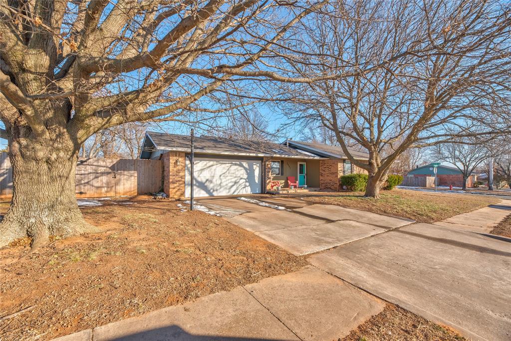 Close to the University of Oklahoma, as well as all of the newly built shopping, off of Classen. Featuring a beautifully landscaped, spacious backyard situated on a corner lot, and a recently remodeled kitchen. This house is very well cared for, and ready for you to make it your home. Upon entrance, you will notice that the living areas are open concept with tile flowing throughout.  The living room features a wood burning fireplace, which flows effortlessly into the dining room. The kitchen was remodeled in 2023, and boasts butcherblock countertops, travertine tile, a dishwasher, built in microwave, electric range, sink, and a brand-new garbage disposal! Off of the dining room, is the laundry room, which connects to the two-car garage, in which there is an in-ground storm shelter. Leading through the double doors onto the backyard patio, to the left you will find a finished deck, extended patio pavers, not to mention the sellers added a waterfall feature last summer, as well as an established raised garden area, and the fence is two years old.
