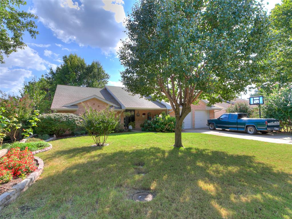 Beautiful well maintained, updated brick home in a very centrally located area. Close to shopping, entertainment and in Putnam City Schools. It is a tri level home, entering into the foyer with a living area off to one side and laundry room as well as powder bathroom to the other side. Down the stairs to the kitchen, den area, a separate dining area and a big master bedroom with bathroom. Upstairs is 3 very generously sized bedrooms all having a lot of closet space and a full large bathroom with separate shower/ tub, double vanities a new quartz countertops in bathroom and recently tiled tub and shower walls.