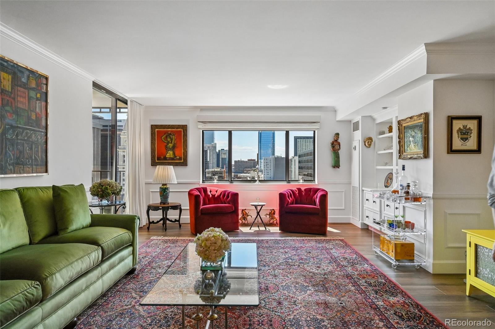 A sophisticated and luxurious downtown retreat awaits at Larimer Place, where refined finishes, elegant updates, and an unbeatable location come together just steps from Larimer Square. This beautifully renovated residence offers a superb urban lifestyle with contemporary flooring, detailed millwork, custom built-ins, crown moldings, bead-board accents, and a bright, open layout designed for both everyday comfort and effortless entertaining. The redesigned kitchen serves as the centerpiece of the home with an expansive island, granite countertops, premium Miele appliances, stylish custom cabinetry, and modern lighting. The dining area flows seamlessly into the spacious living room, where sliding glass doors open to a 100 square-foot east-facing terrace with captivating downtown views. The generous primary suite features terrace access, a custom walk-in closet, city views, and a remodeled five-piece bath. A sizable secondary bedroomalso with terrace access offers flexibility for guests, a home office, or additional living space, with a full bath and in-unit laundry nearby. Professionally managed and exquisitely maintained, Larimer Place HOA covers 24-hour security, concierge, tennis/pickleball court, fitness center, sauna, heated outdoor pool,cabanas, clubhouse, lounge areas, fire pits, barbecues and two bike cages (no charge) for EV and regular bikes. It also includes two coveted parking spaces plus free guest parking. New owner can also use unit as an income property with a 1 year minimum sublease. Step outside and enjoy the best of downtown Denver with Larimer Square, restaurants, shopping, theatre, museums, sporting venues, and entertainment all walkable moments from your front door. This is downtown living at its finest that feels exciting, convenient, polished, and effortless.