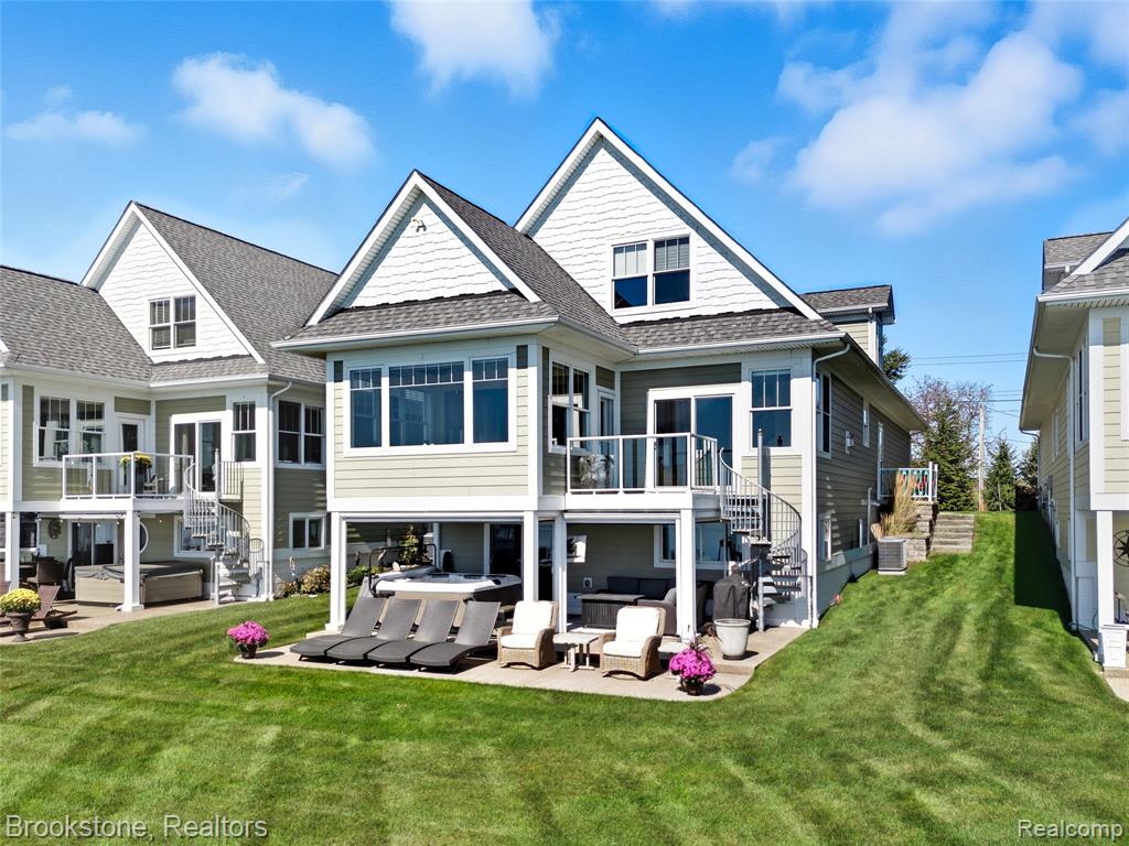 Luxury lakefront home! Rare opportunity to own a stunning, custom 3-level home with approximately 3,558 sq. ft. of finished living space and unbeatable water views and lake access. Main level living features a bedroom and full bath, spacious living room with fireplace, bright kitchen, sunroom, and laundry. The upper level offers three additional bedrooms and two full baths. The lower walkout is a boater’s-entertainment dream—bar, large living/dining areas, cozy fireplace and ample storage/utility space. Professionally painted rooms and custom window & door blinds throughout. Step outside to a beautiful aggregate patio with hot tub, outdoor television and remote screens for full patio enclosure, then walk right to your private dock equipped with a 24,000 lb electric boat hoist and electric, remote waverunner/jet ski lift. Additional boat slips are available for visiting family and friends. Convenient dockside electric and water. Enjoy world-class fishing, boating, kayaking—and in winter, ice fishing, skating and snowmobiling—right from your own backyard. Short bike ride or boat cruise to charming downtown New Baltimore’s restaurants, boutiques, farmer’s market and marina. Easy access to expressways—just 10 minutes to I-94. Wake up and close the day with the most amazing sunrises and sunsets.
This is the ultimate in lakefront living—schedule your showing today!