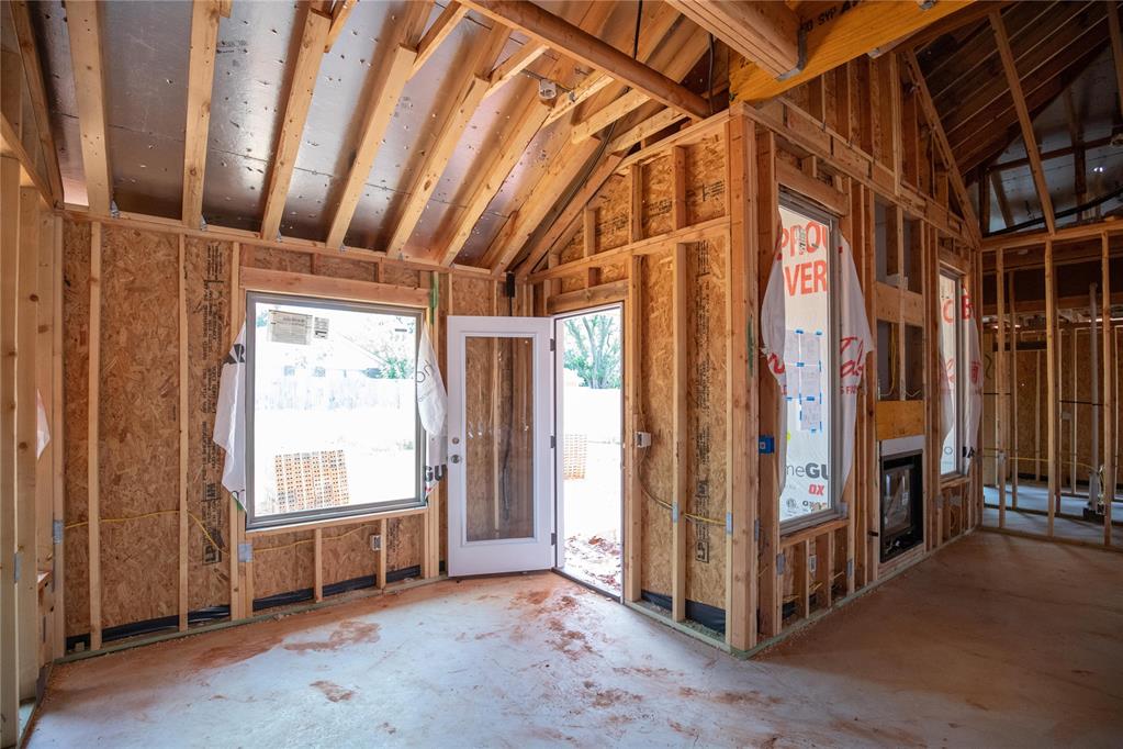 This Hummingbird floor plan features 2,025 Sqft of total living space, which includes 1,800 Sqft of indoor space and 225 Sqft of outdoor living. There is a 565 Sqft, three car garage with an in-ground storm shelter installed. This home offers 4 bedrooms, 2 bathrooms, 2 covered patios, and a large utility room. The great room welcomes a breathtaking cathedral ceiling, a gas fireplace with our stacked stone surround detailing, large windows, rocker switches throughout, wood-look tile, and Cat6 wiring. The high-end kitchen has 3 CM countertops, custom-built cabinets to the ceiling with cabinet hardware installed throughout and under cabinet lighting, stainless steel appliances, a 5-burner cooktop, vogue tile backsplash, stellar pendant lighting, a corner walk-in pantry, and a large center island equipped with a trash can pullout, farm sink, and dishwasher. The elegant primary suite has a sloped ceiling detail with a ceiling fan, windows, Cat6 wiring, and our cozy carpet finish. The attached spa-like bath includes a dual sink vanity with framed mirrors, TWO spacious walk-in closets, a roomy European walk-in shower, and a free-standing tub. Secondary bedrooms feature high ceilings with ceiling fans, windows, spacious closets, and carpeted flooring. The covered back patio offers a wood burning fireplace, a TV hookup, and a gas line for your grill. Other amenities include Healthy Home Technology, a fresh air ventilation system, a tankless water heater, R-44 insulation, and more!