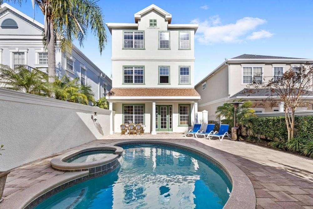 Ready for an exceptional home? This 5 bedroom, 5 bathroom pool home in Reunion Resort sits on one of the most sought-after view lots in the entire community offering sweeping golf course views, nightly Disney fireworks, and even rocket launches from the Space Coast. Spanning over 3,700 square feet across three levels with a private in-home elevator, the home is designed for flexibility and comfort. A separate suite with its own living area, bedroom, and bathroom provides the perfect setup for guests, multi-gen living, or rental potential. This is an entertainer or golfer’s dream, with multiple balconies, a private pool, a separate pool bath, a beautiful paved courtyard, and open-concept living spaces designed to flow seamlessly indoors and out. Enjoy some fun in the sun in your beautiful, private courtyard that contains the sparkling spa/pool combo with separate pool bath. This home comes with a coveted Reunion Resort membership available for transfer, granting access to world-class amenities including three signature golf courses, a water park, tennis and pickleball courts, dining, and more. Whether you’re looking for a primary residence, vacation home, or investment opportunity – this home offers the lifestyle and location to match. Schedule your private showing today.