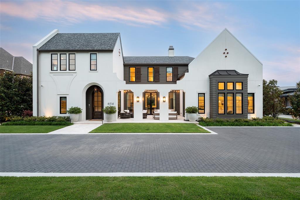Incredible Preston Hollow estate by Jim Scott + Sons Custom Homes, masterfully designed by AIA architect Eddie Maestri of Maestri Studios. Inspired by the timeless architecture of Rosemary Beach, this Cape Dutch Traditional showcases exceptional craftsmanship, bespoke finishes, and sophisticated design throughout. The striking exterior features a redesigned front elevation with a paver driveway, market lighting, professional landscaping, lush turf, mature magnolia trees, and extensive landscape lighting. The resort-style backyard is designed for effortless entertaining with a custom pool and spa, frameless glass fence, stone decking, water feature wall, expansive patios, Phantom screens, in-ceiling heaters, and Sonos outdoor audio. Inside, designer finishes include custom tile, upgraded lighting, motorized shades with custom drapery, black-painted window frames, and custom mirrors throughout. The chef's kitchen features Taj Mahal quartzite countertops, custom open shelving, a built-in ice maker in the butler's pantry, and a custom metal pantry door. The luxurious primary suite offers a spa-inspired bath with a custom metal-framed shower, updated vanity, built-in shelving, and an enhanced custom closet. Additional amenities include whole-home Sonos audio, Verkada security system, whole-home generator, integrated AV, a climate-controlled insulated garage with epoxy flooring, dedicated fitness room, designer-built furnishings, and custom metal doors. A rare opportunity to own a truly exceptional luxury home in one of Preston Hollow's most sought-after neighborhoods.