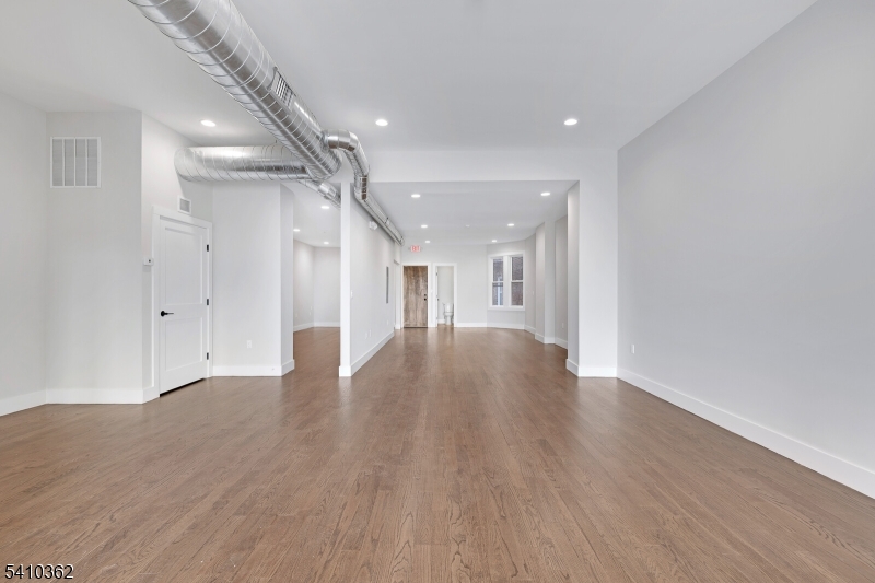 Location, Location, Location. Newly constructed, high-end professional office space available for lease on Main Avenue in Clifton. Offering approximately 1,323 square feet on the second floor with a private entrance, this modern space is thoughtfully designed for today's professional user, featuring sleek finishes, rich flooring, abundant natural light, and a private restroom for added convenience.The open layout provides a versatile, clean canvas that can be customized to fit your business needs. Ideal for medical, wellness, legal, financial, creative, or boutique retail users seeking a polished and elevated presence in a prime business corridor. Landlord is open to build-to-suit improvements with favorable lease terms, allowing tenants to tailor the space to their exact specifications.Clients and staff will appreciate immediate access to a large municipal parking lot with approximately 200 complimentary spaces directly behind the building. Gross lease structure with no surprises extra costs ensures simple, predictable monthly expenses.Positioned in a high-traffic commercial district with strong visibility and easy accessibility, this is a rare opportunity to secure luxury office or retail space in one of Passaic County's most convenient and established business locations.